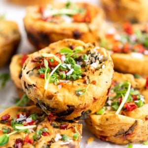 Vegan mini quiches, with one stacked on top of two others