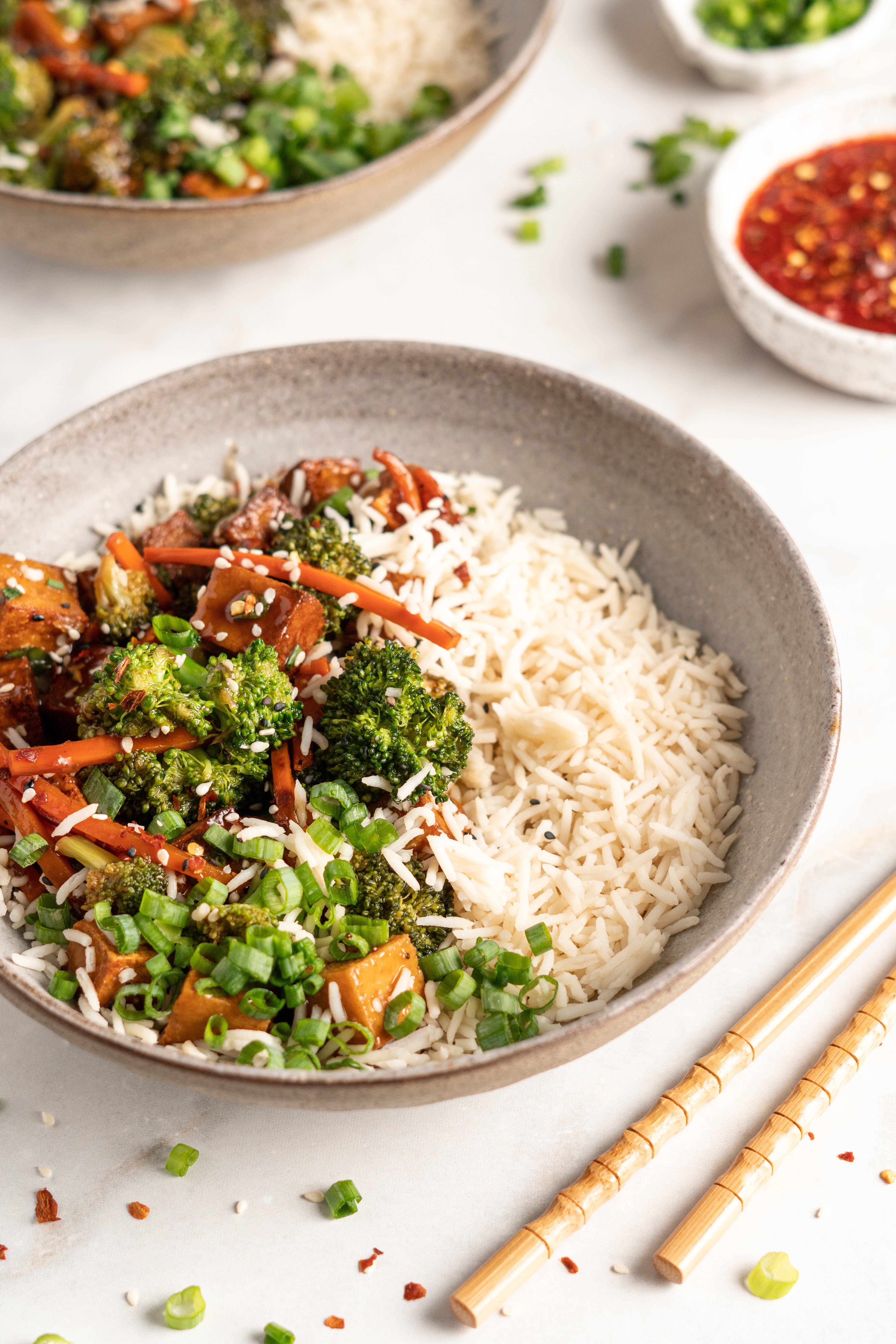 Bowl of tofu and veggie stir fry with white rice