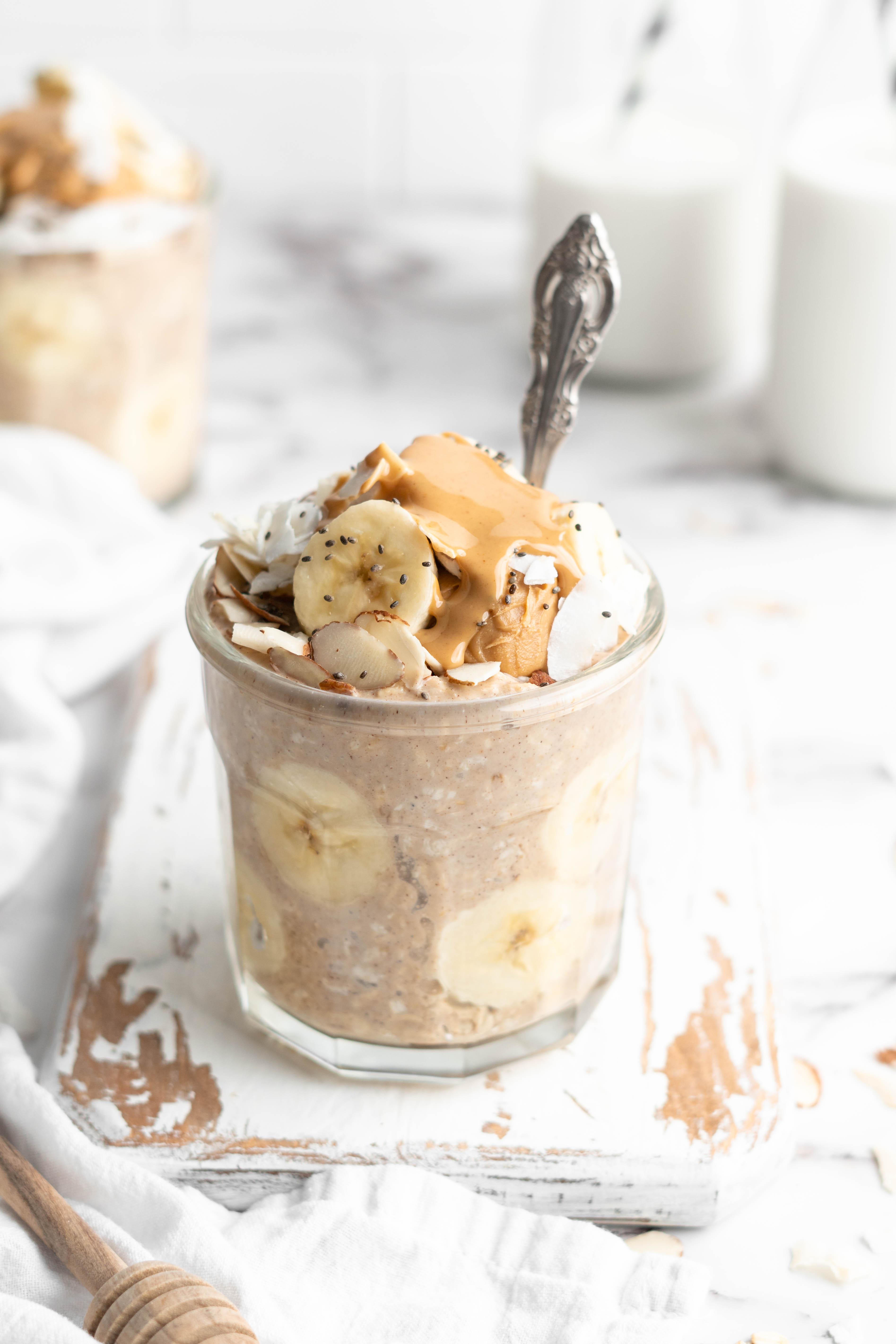 Peanut butter banana overnight oats in jar with spoon
