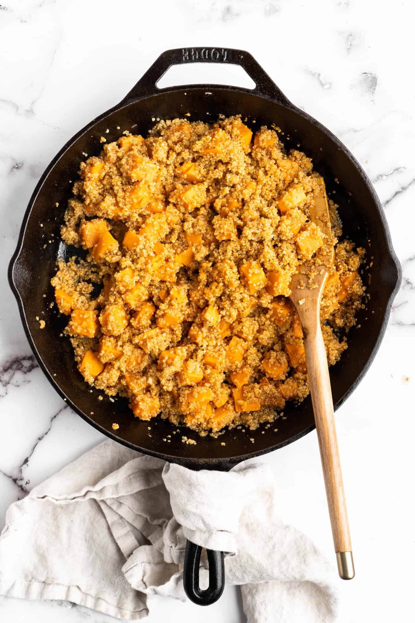Overhead view of sweet potatoes and quinoa in skillet