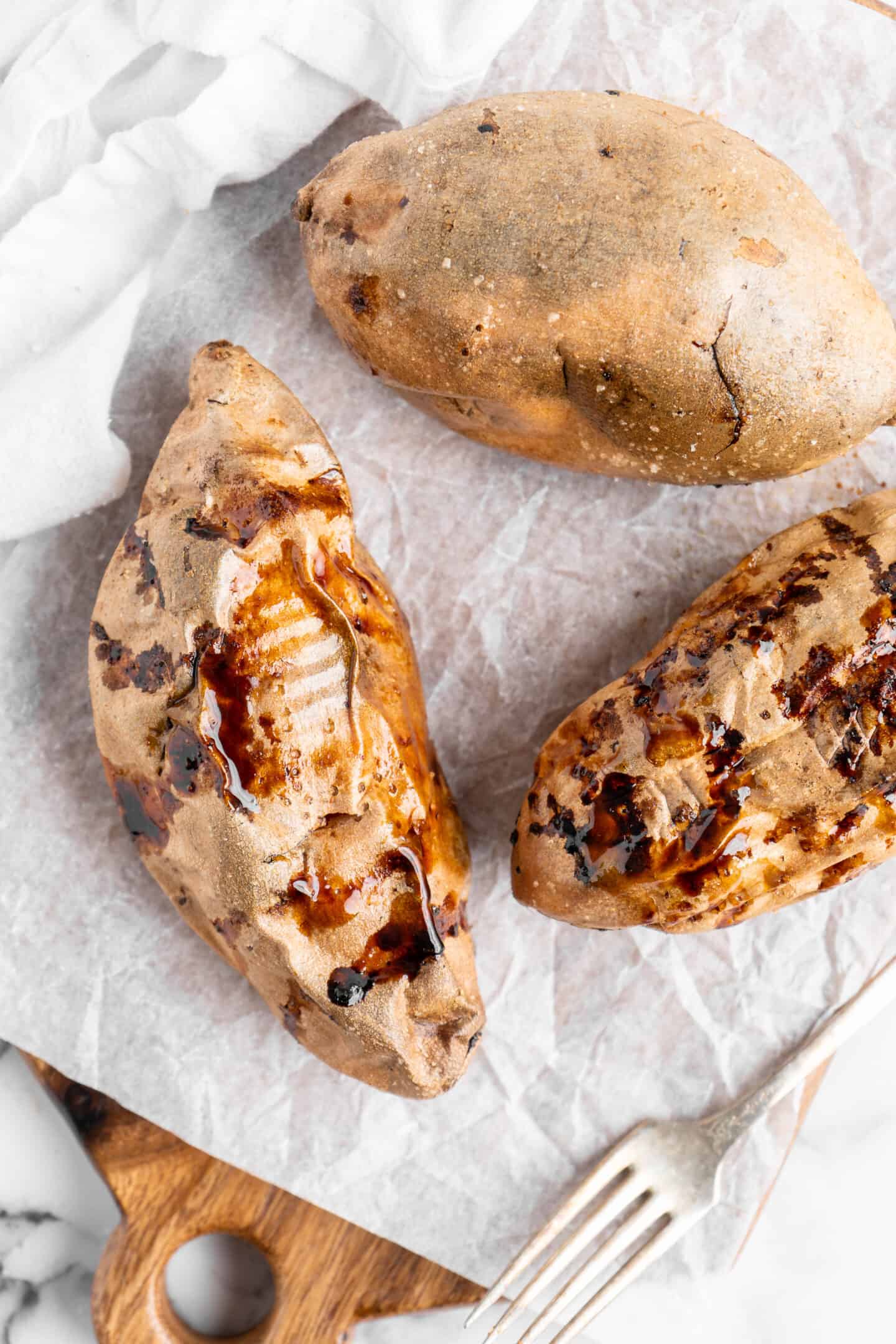 Air fryer sweet potatoes on parchment paper