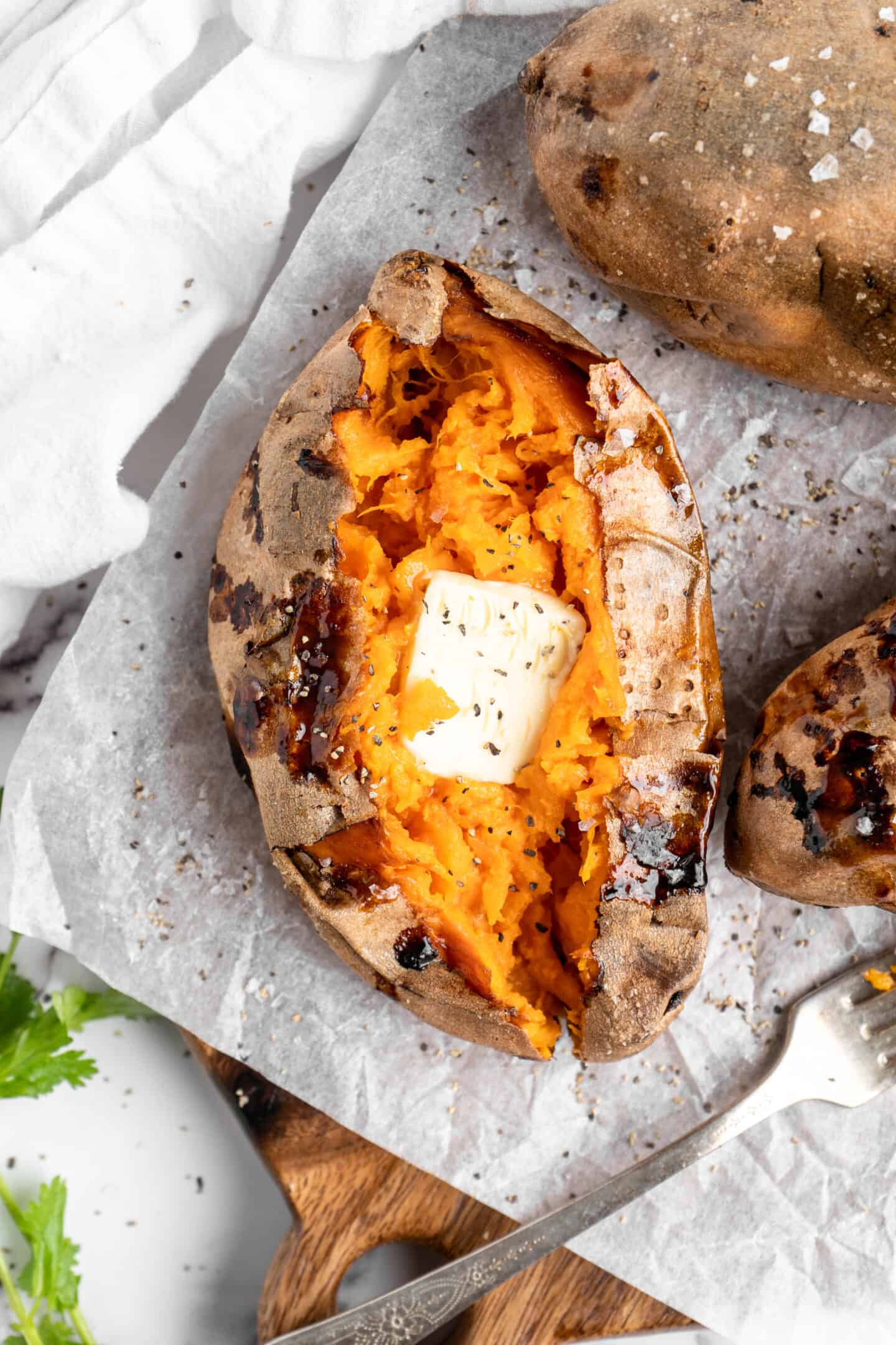 Air fryer sweet potato topped with butter