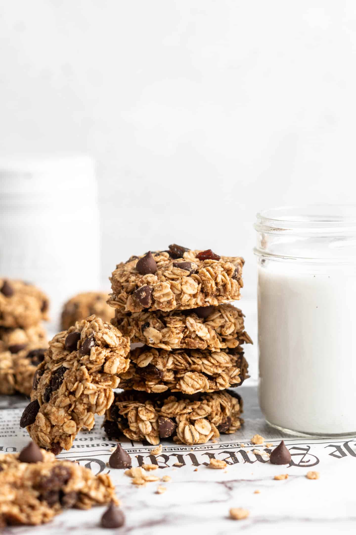 Stack of banana oatmeal cookies next to jar of milk