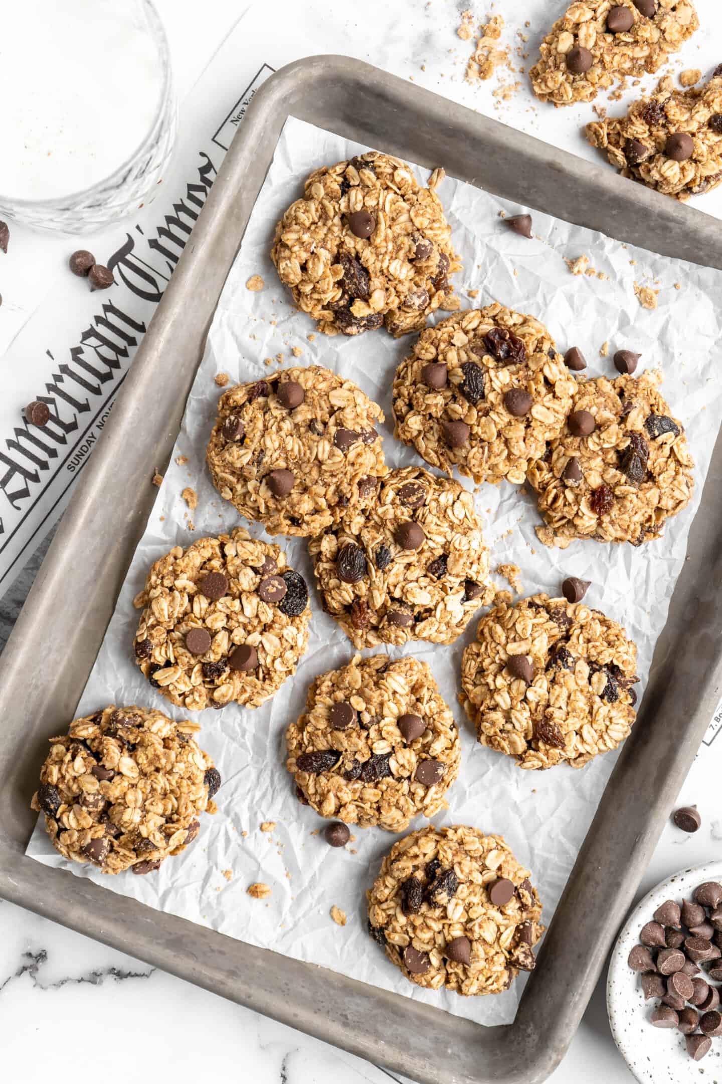 Overhead view of banana oatmeal cookies on a baking sheet.