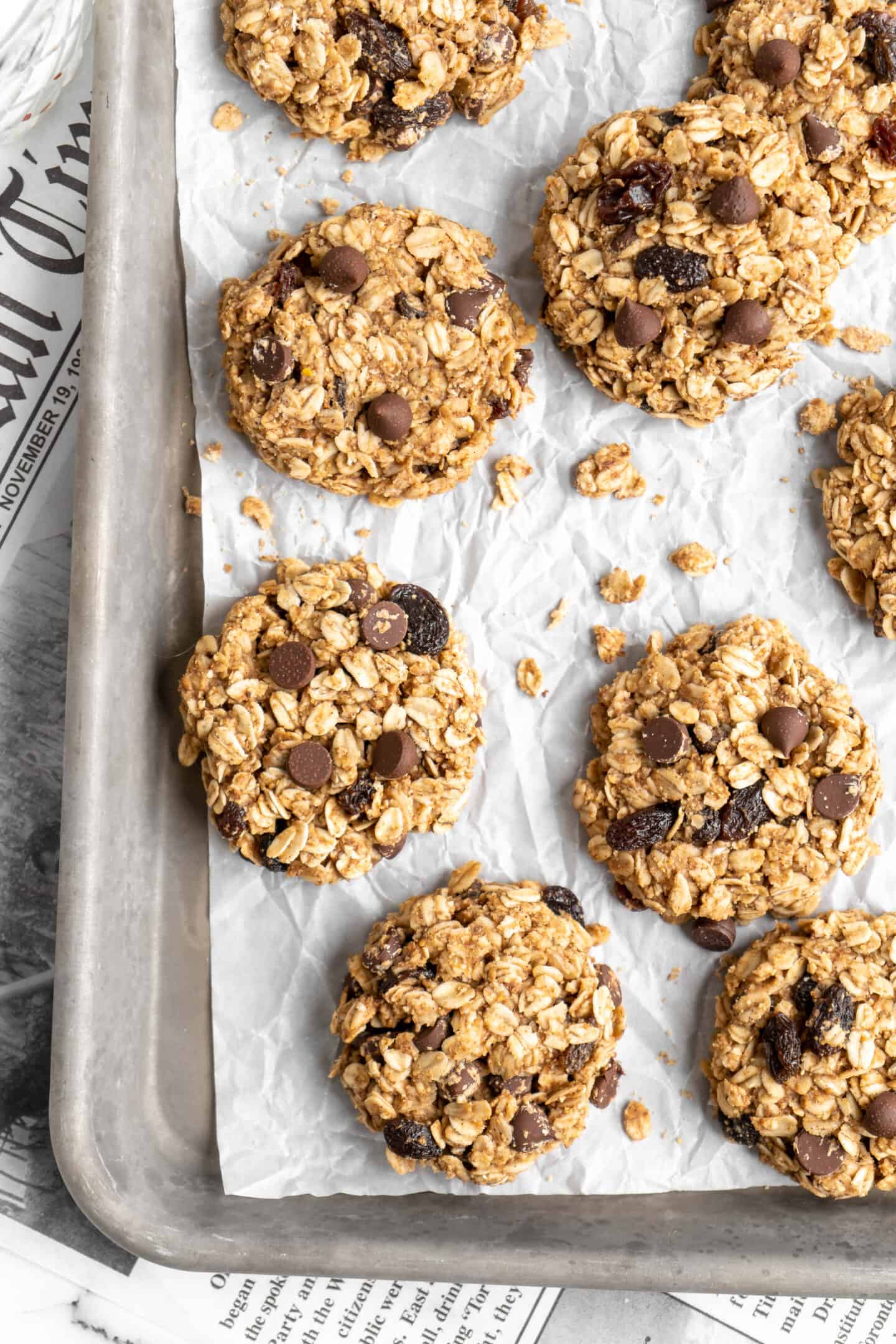 Overhead view of banana oatmeal cookies on parchment lined baking sheet