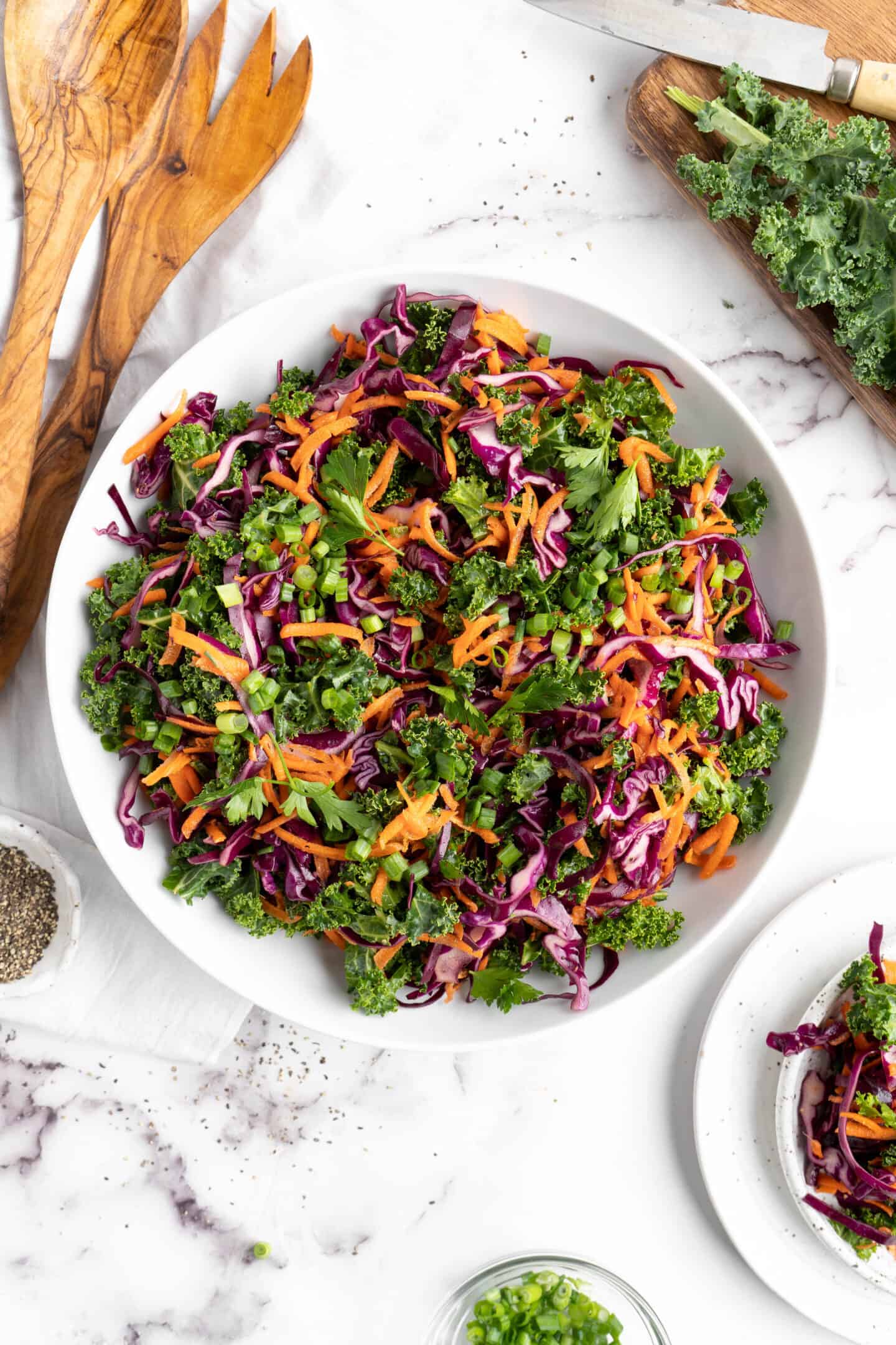 Overhead view of kale slaw in large bowl.