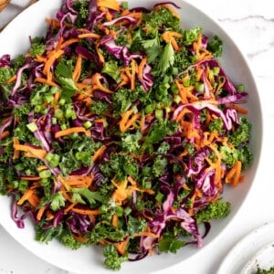 Overhead view of kale slaw in large bowl.