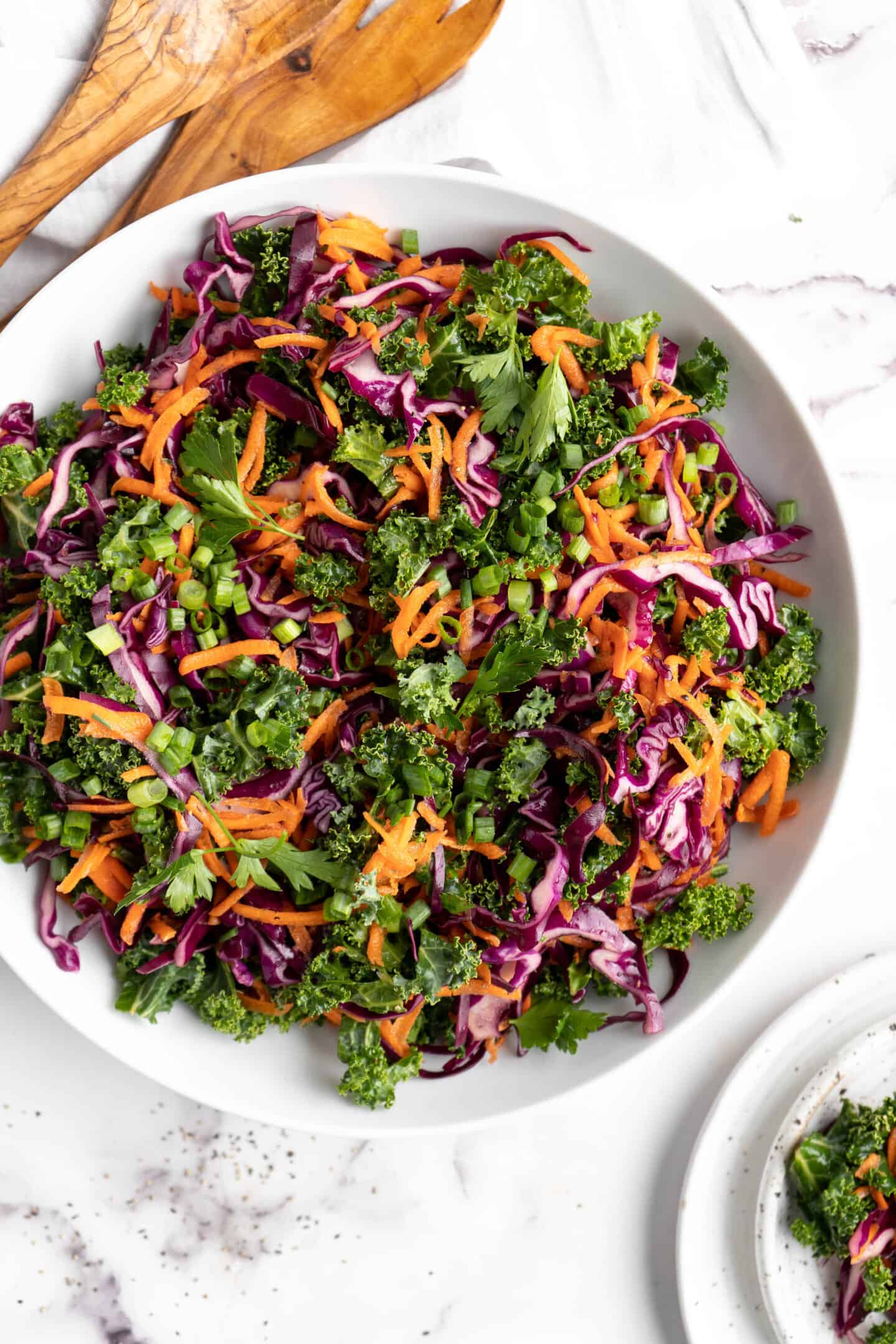 Overhead view of kale slaw in large bowl.