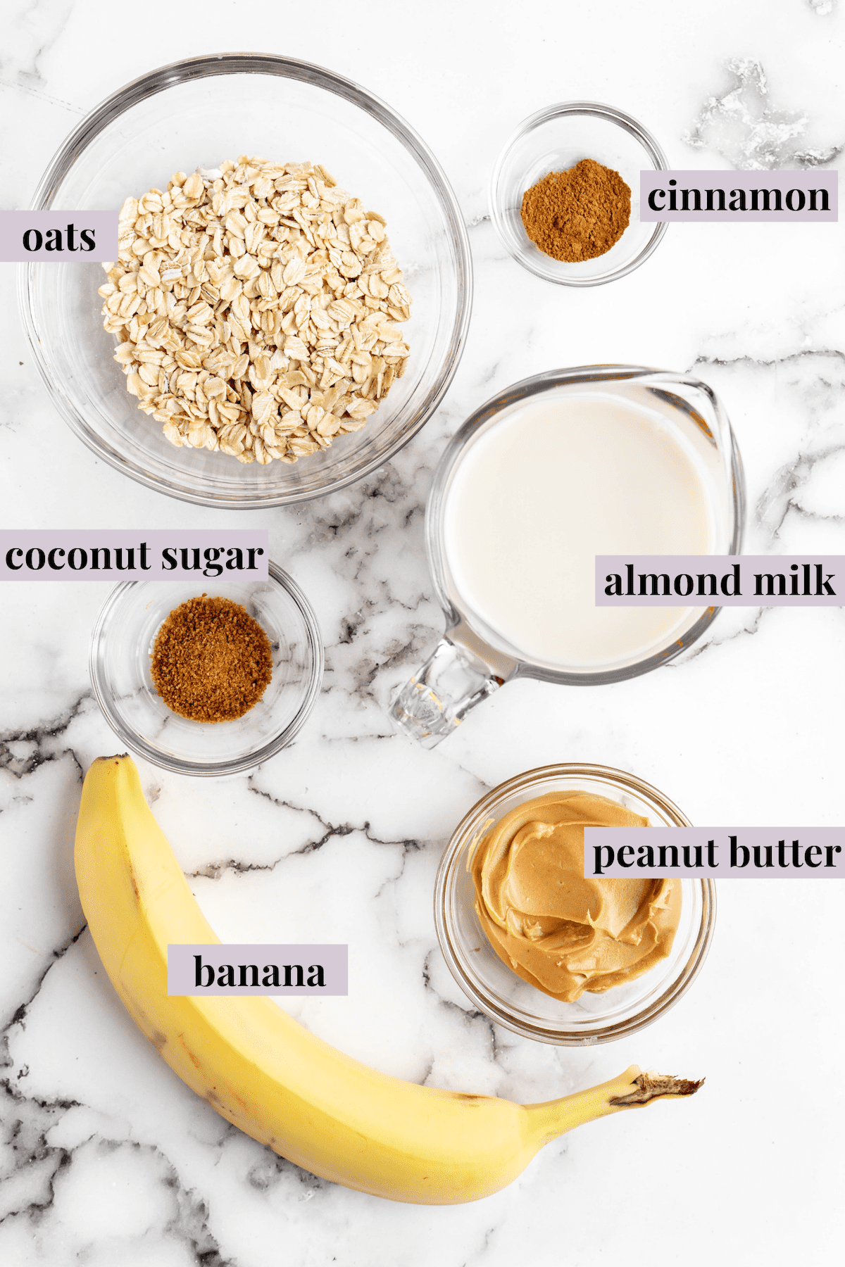 Overhead view of peanut butter banana overnight oats ingredients with labels