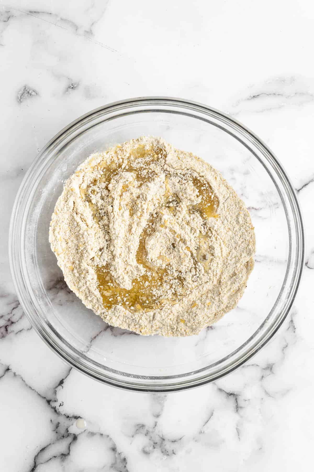 Ingredients for vegan cheese crackers in glass bowl