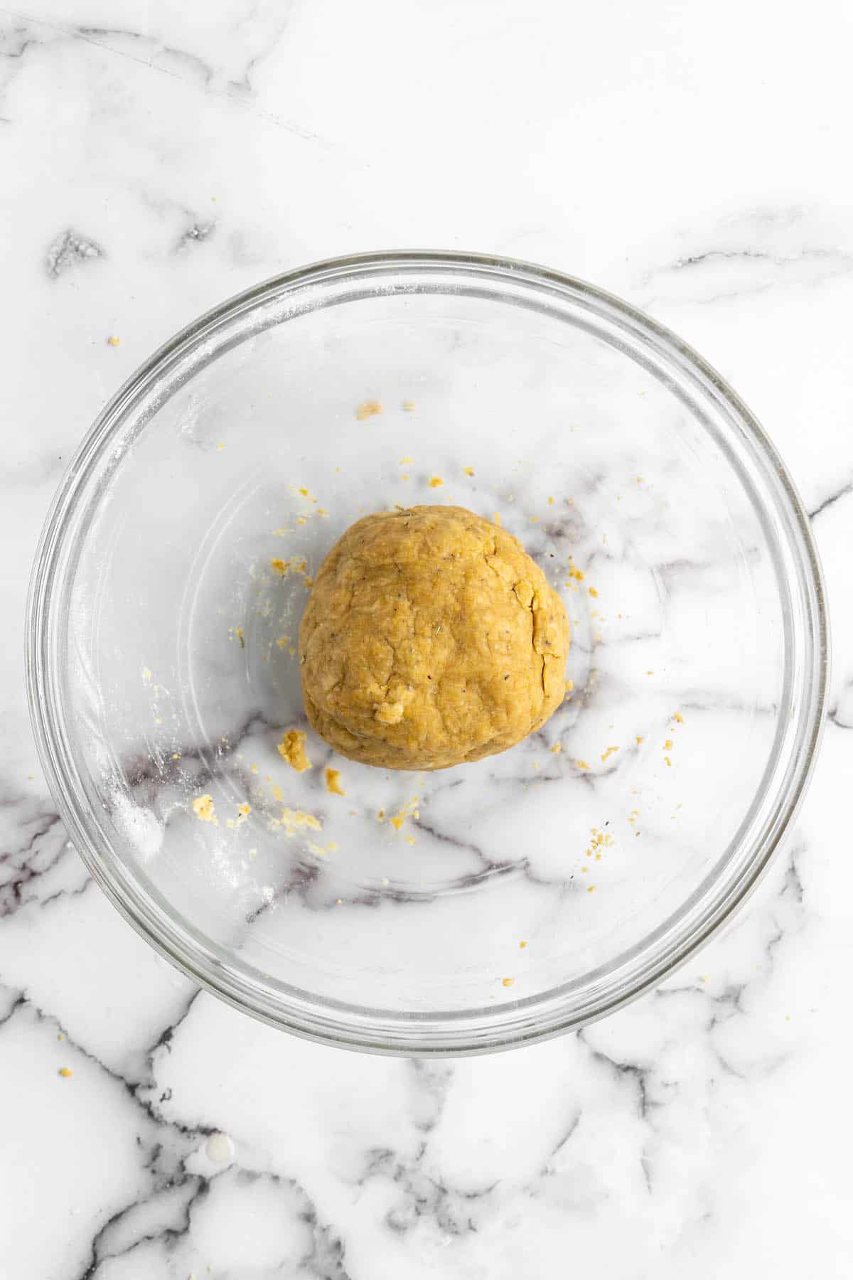 Vegan cheez-it dough in glass bowl