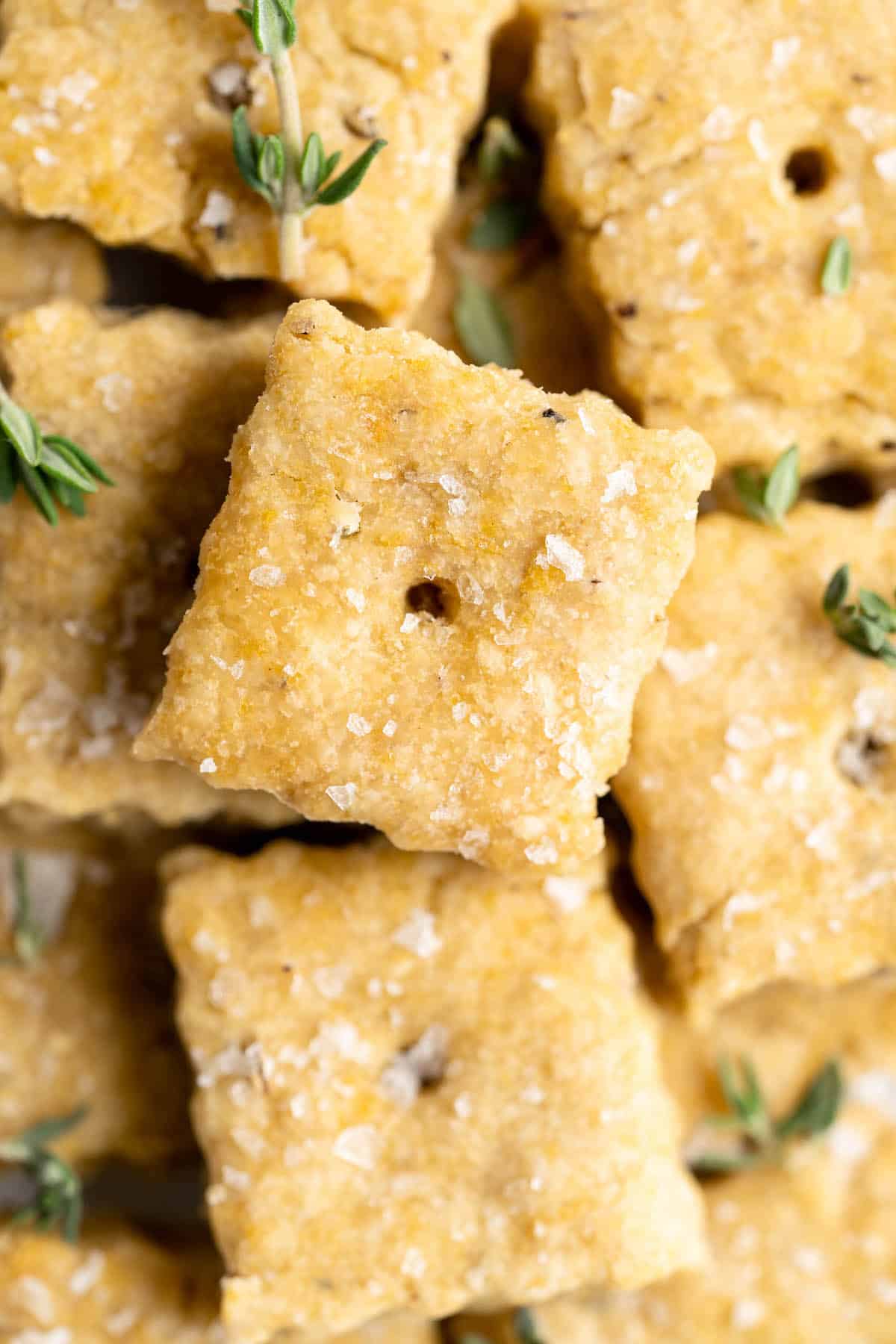 Closeup of vegan cheez-its with sea salt and rosemary