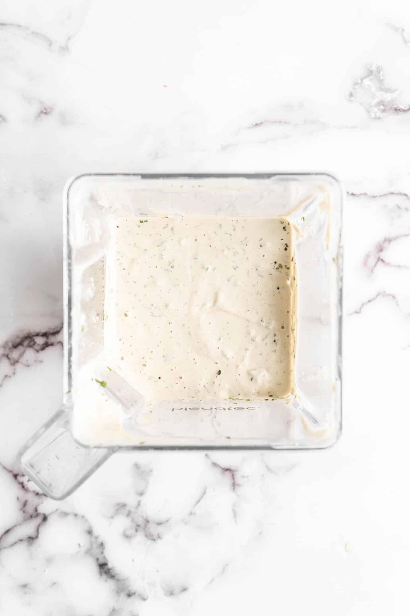 Overhead view of vegan ranch dressing in blender jar