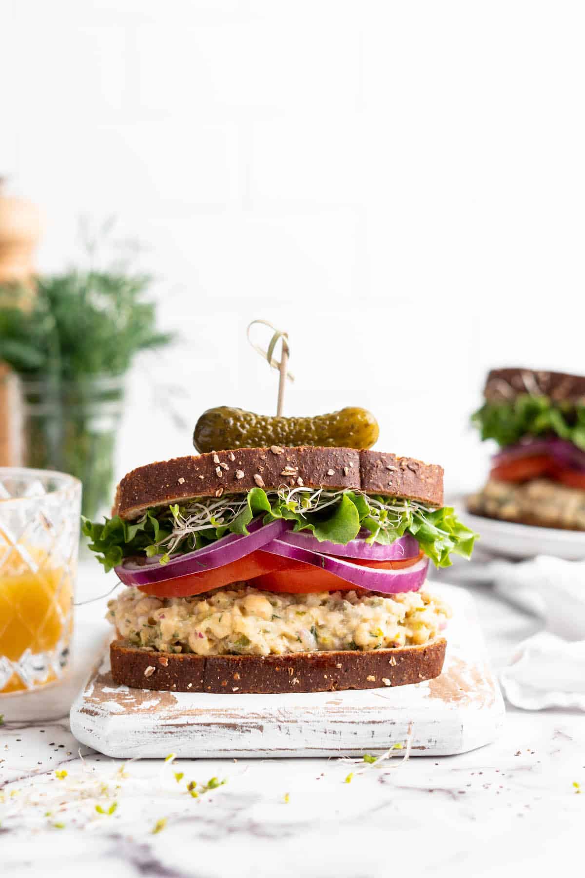 Vegan chickpea tuna sandwich on cutting board