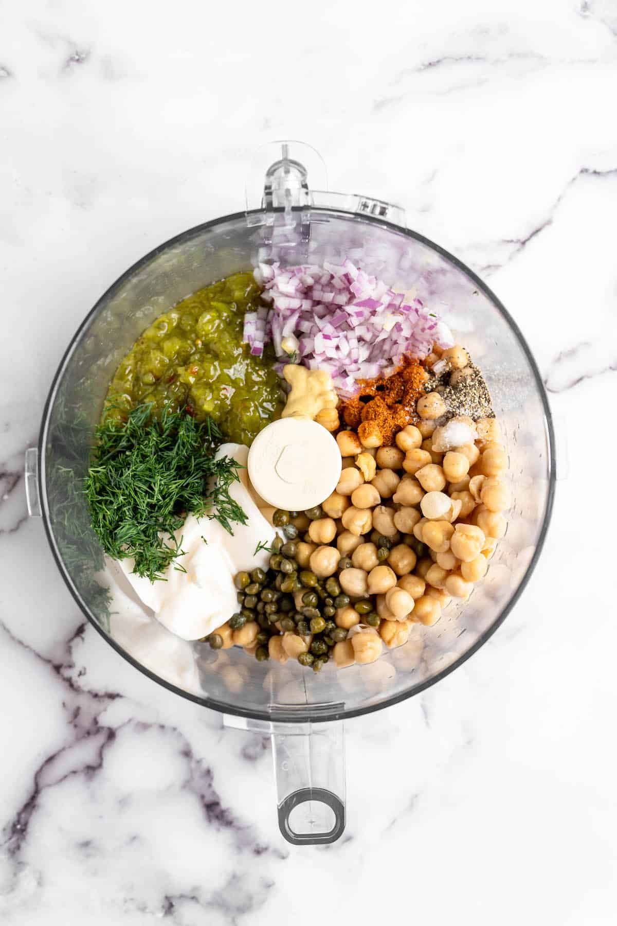 Overhead view of vegan tuna ingredients in food processor bowl