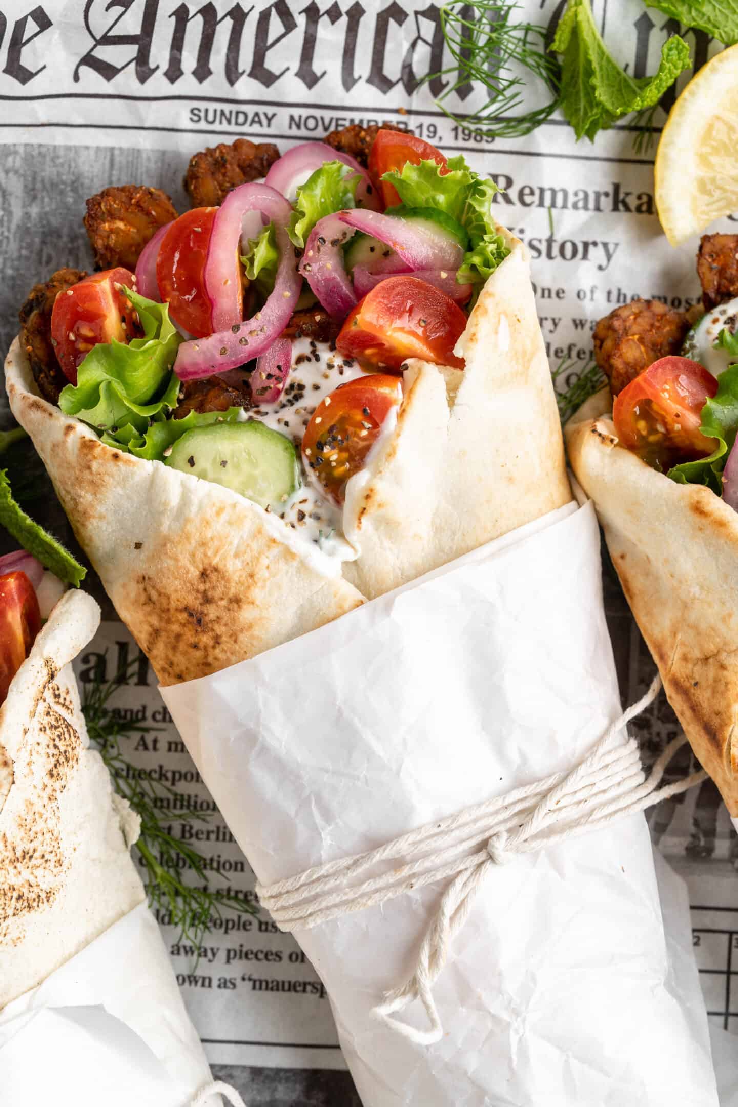Vegan gyros wrapped in parchment and string