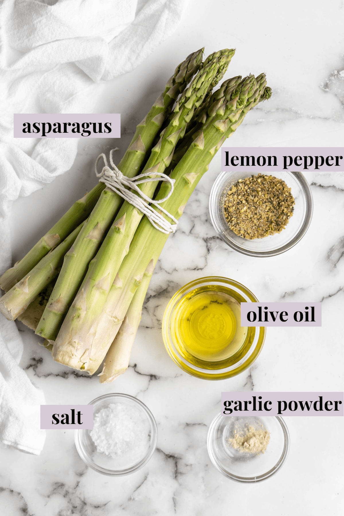 Overhead view of air fryer asparagus ingredients with labels