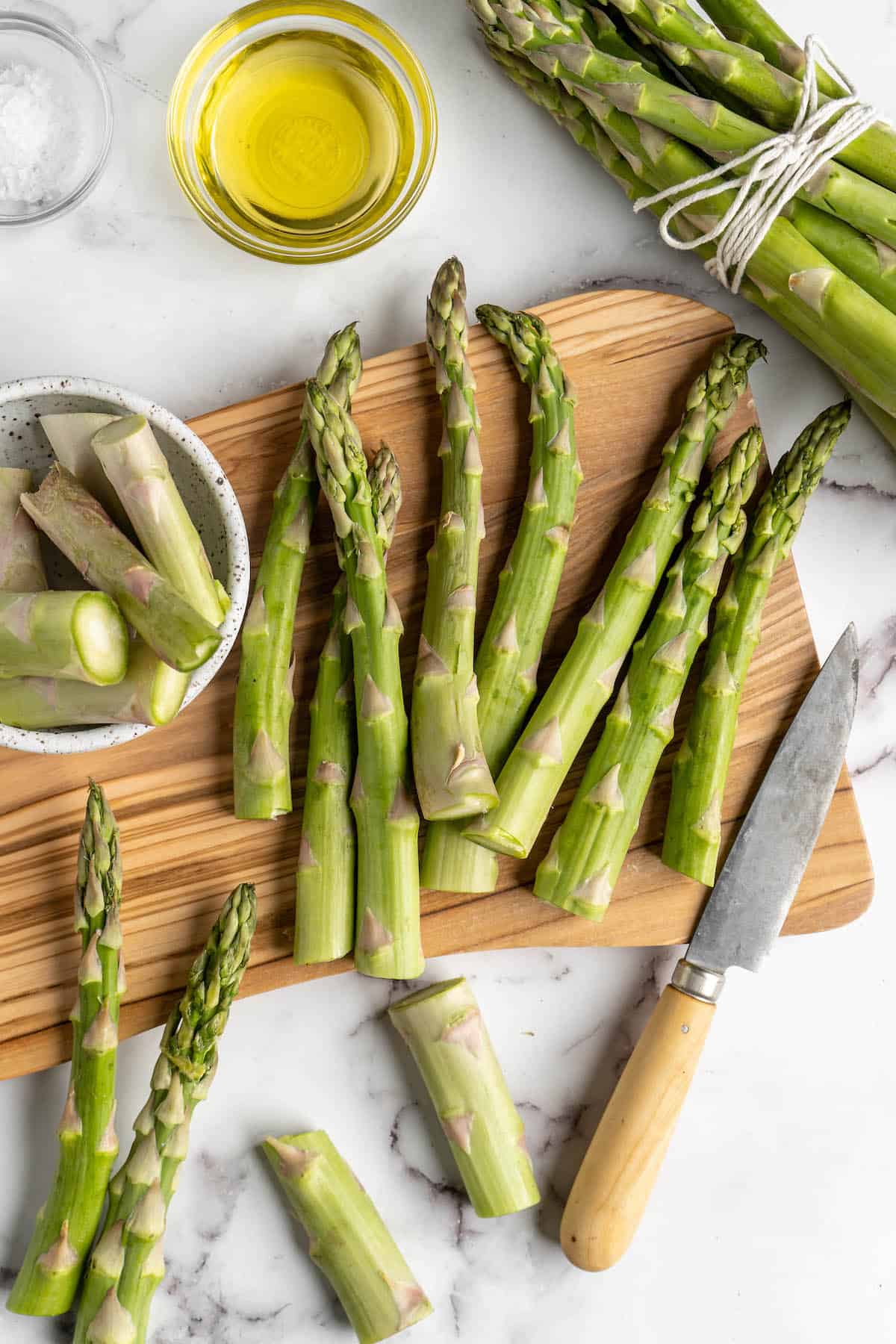 Overhead view showing asparagus being trimmed