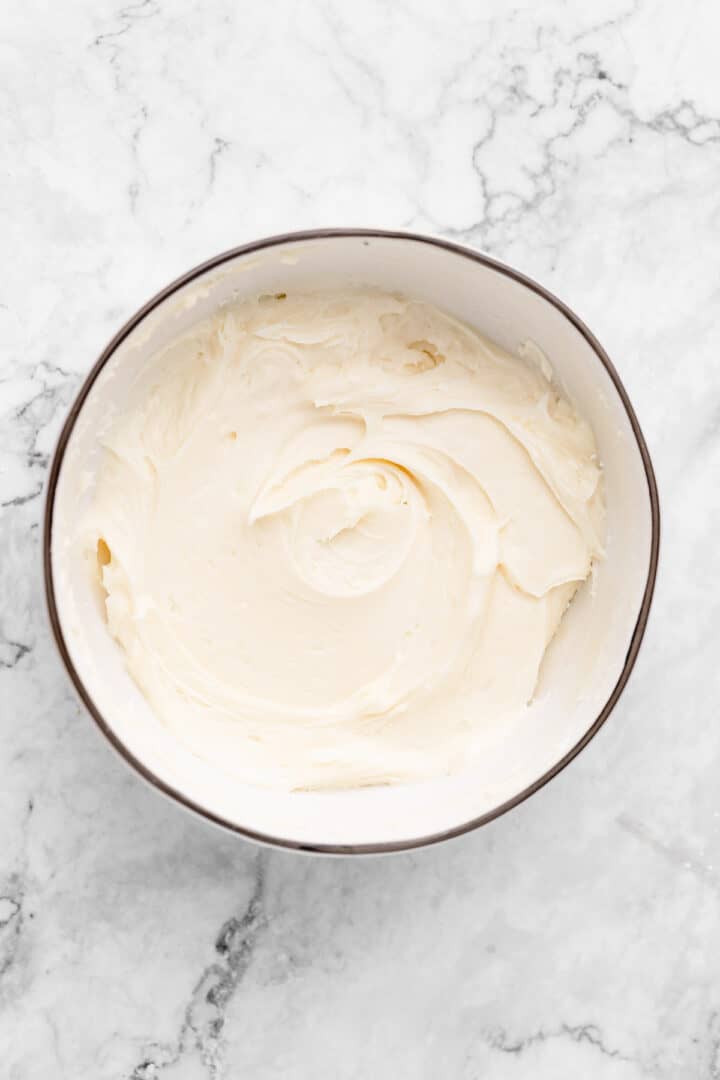 Mixing bowl with vegan cream cheese frosting inside