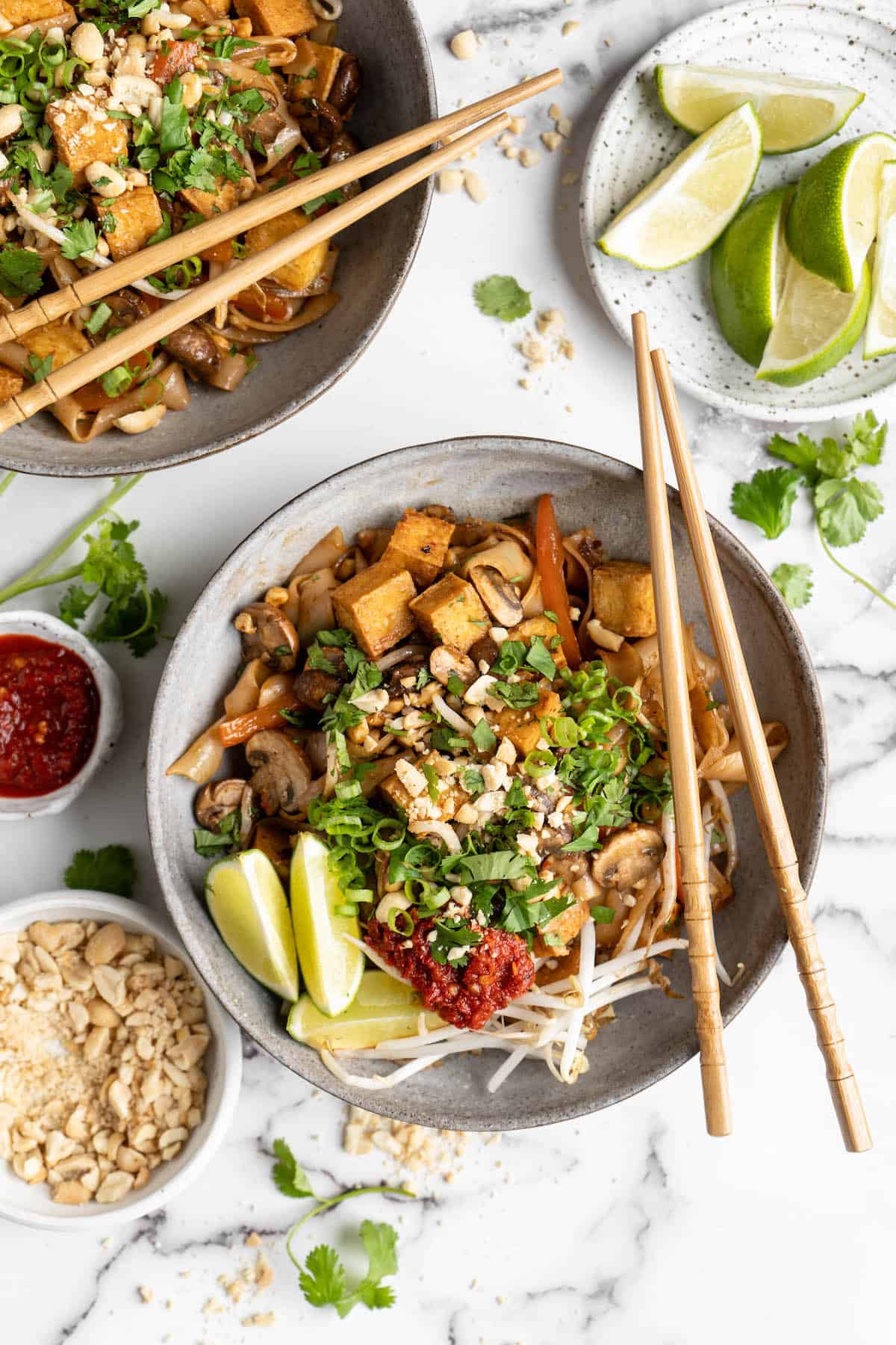 Overhead view of vegan Pad Thai in two bowls