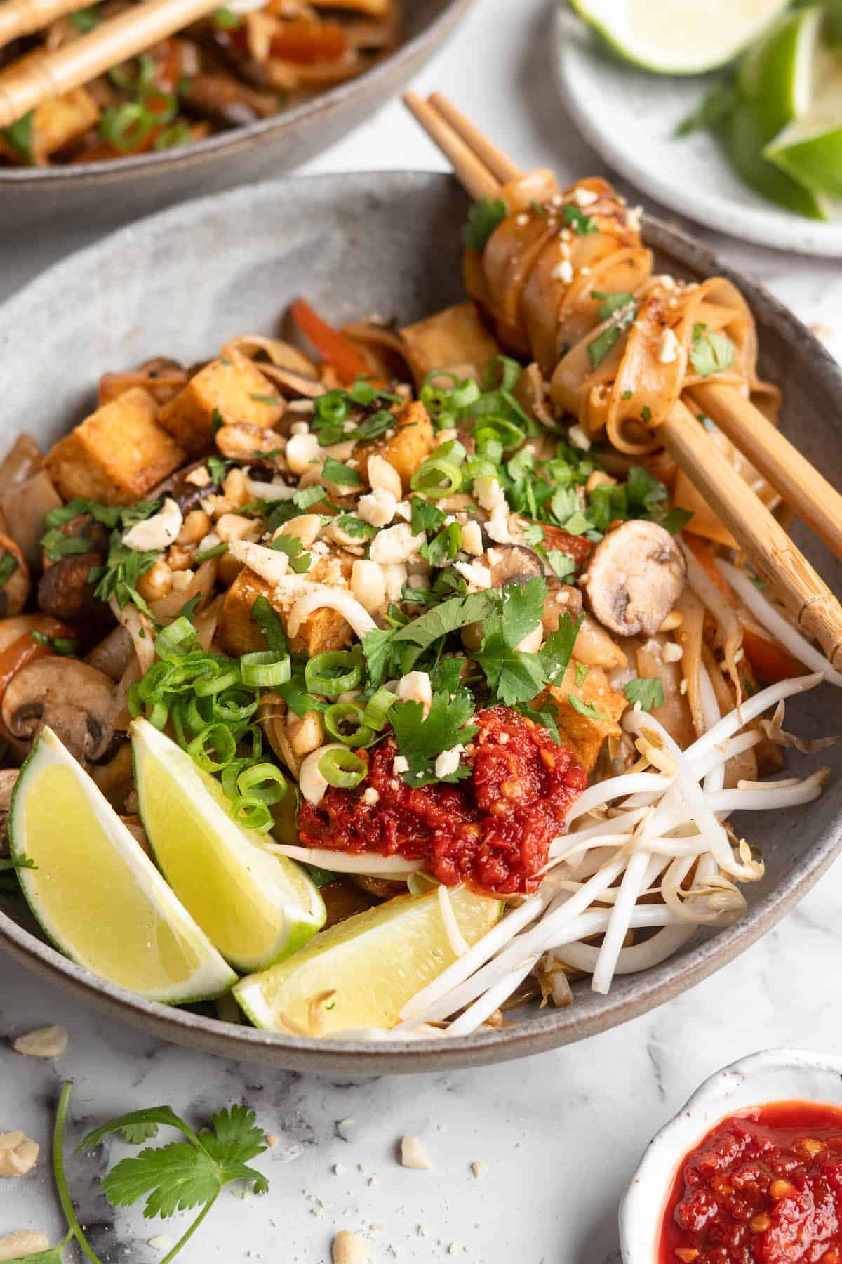 Bowl of vegan Pad Thai with toppings