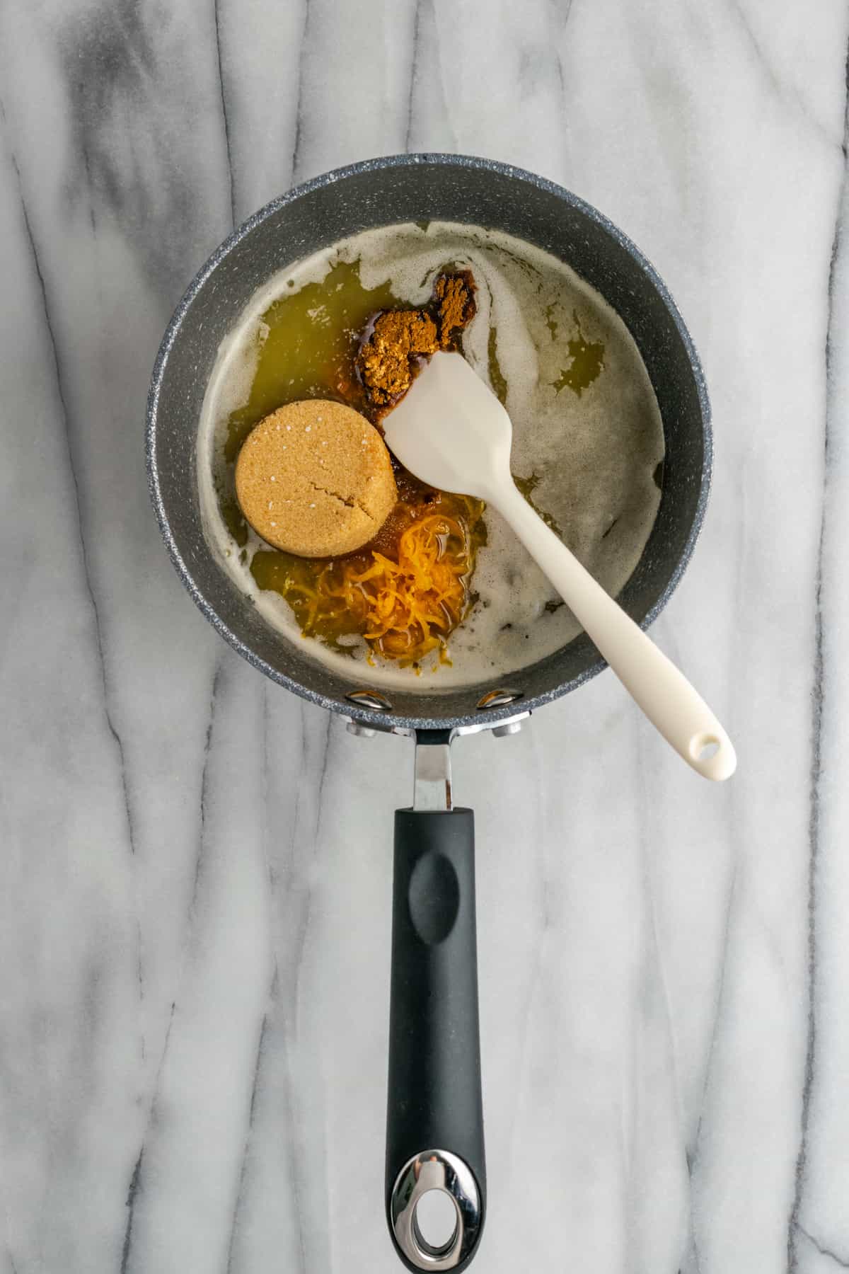 All the ingredients for candied yam sauce in the saucepan