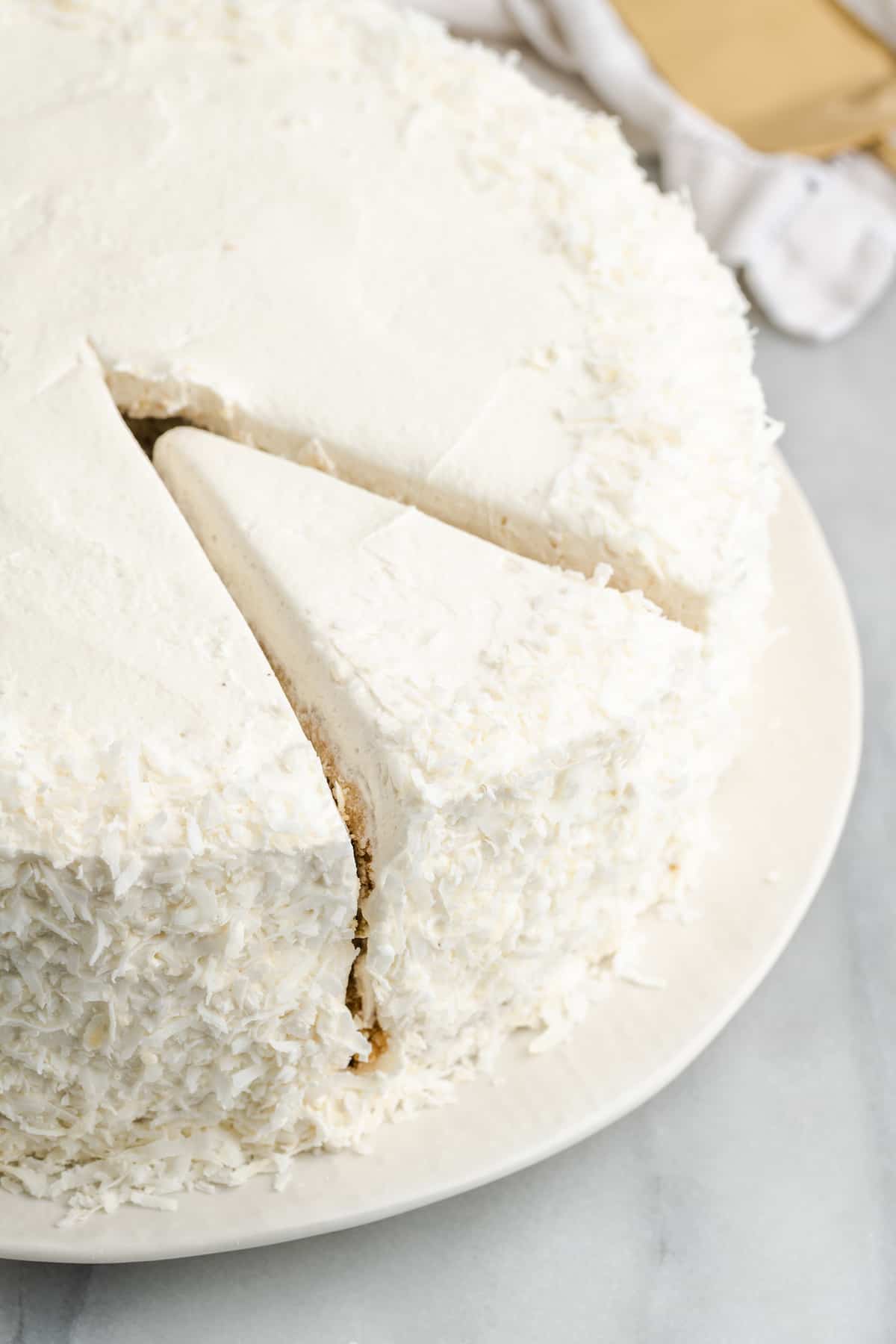 full vegan coconut cake, sliced