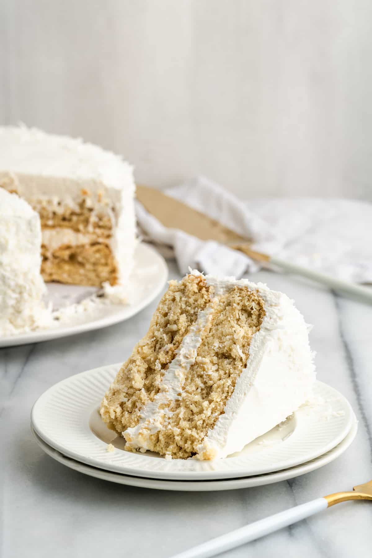 vegan coconut cake with a slice removed