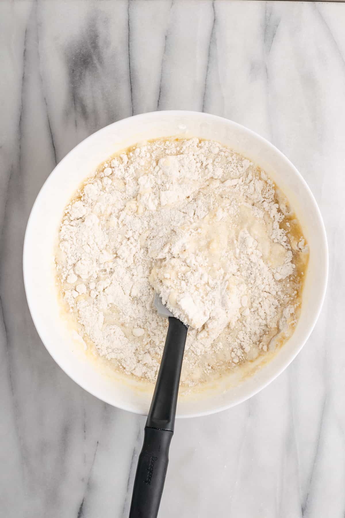 mixing batter for vegan coconut cake