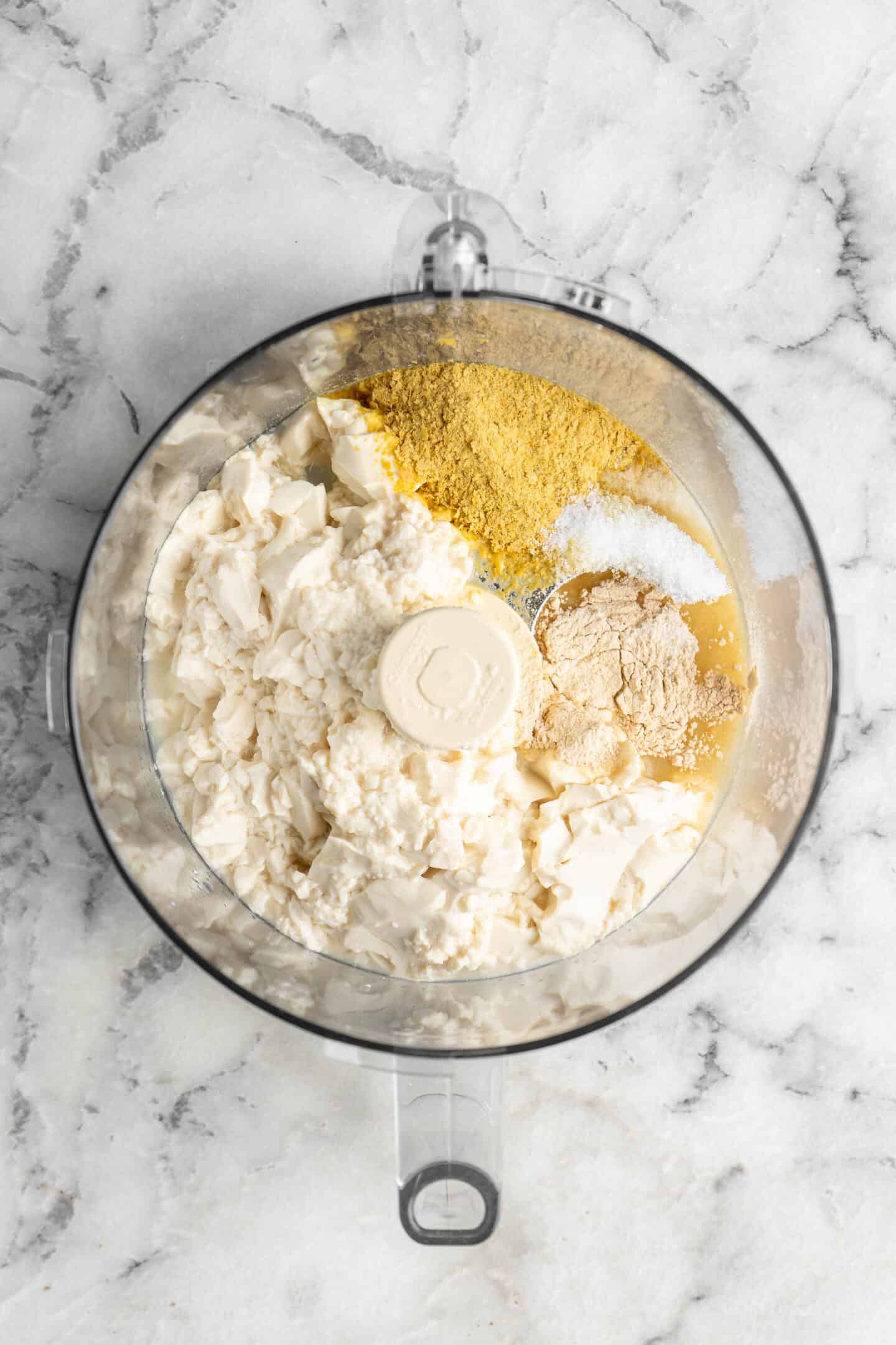 Ingredients for vegan ricotta in a food processor
