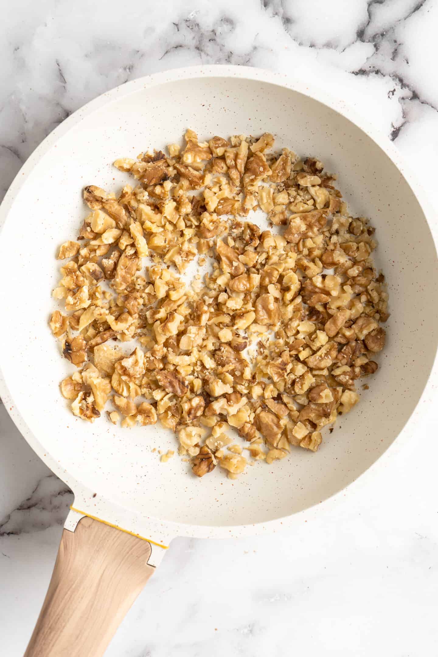 A pan filled with toasted walnuts