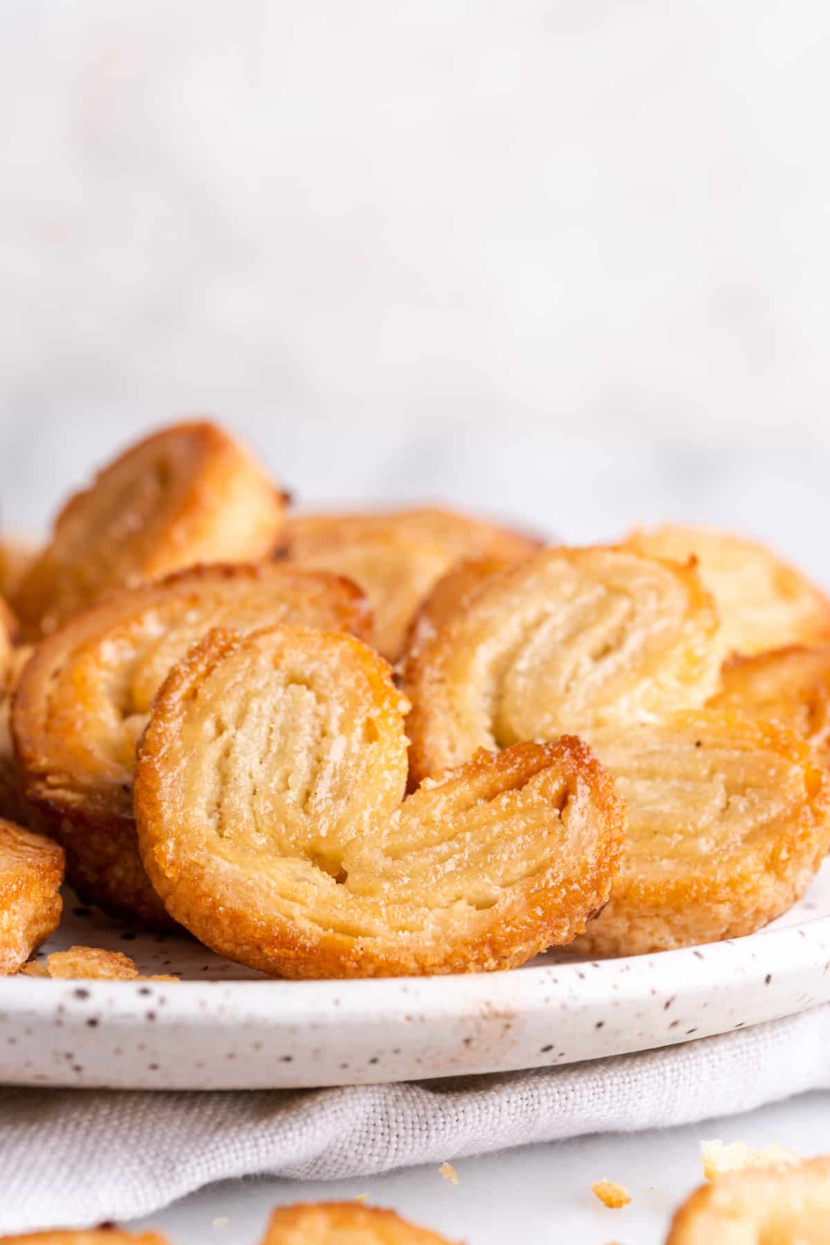 Close up of a plate of puff pastry palmiers
