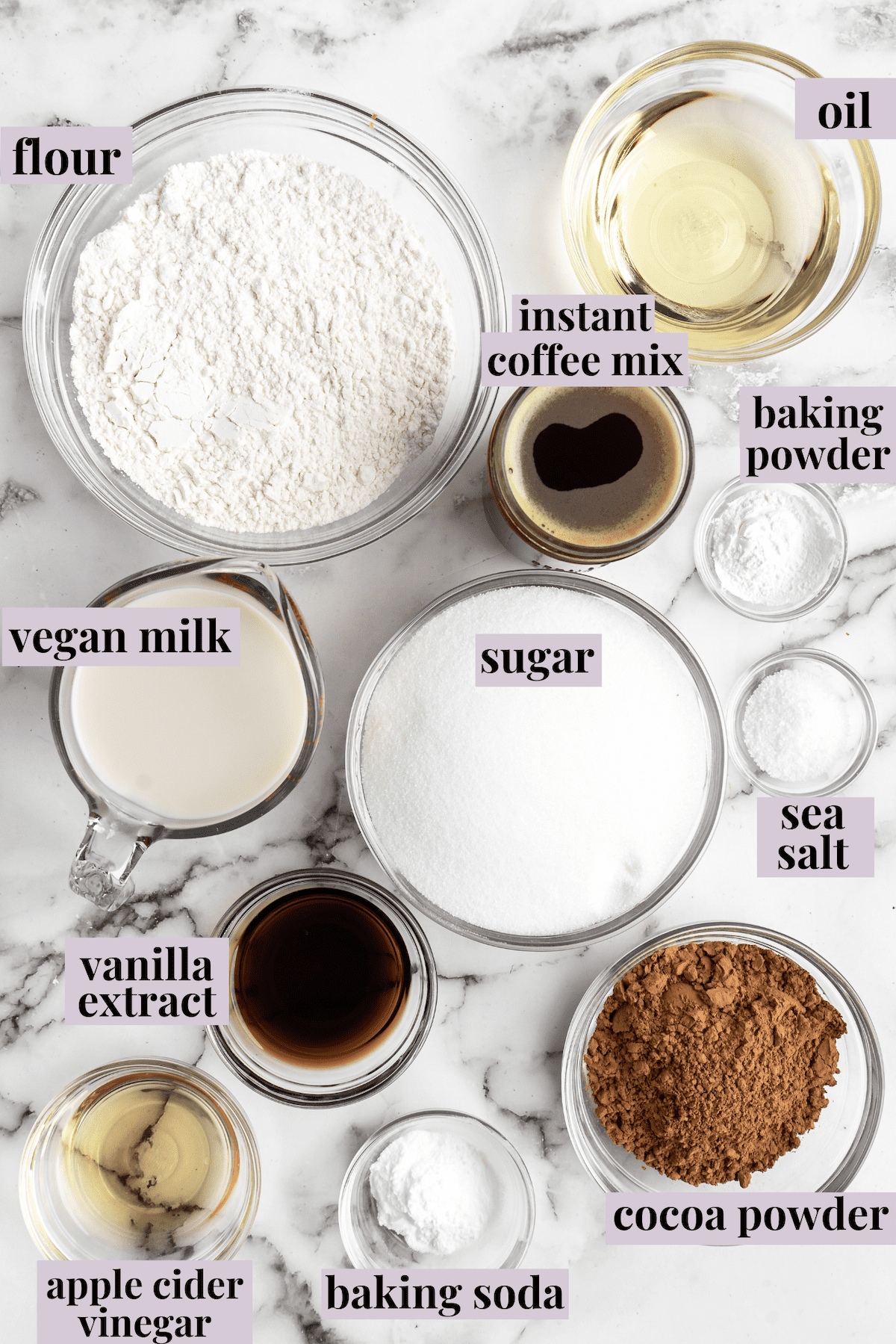 Overhead view of vegan chocolate cake ingredients with labels