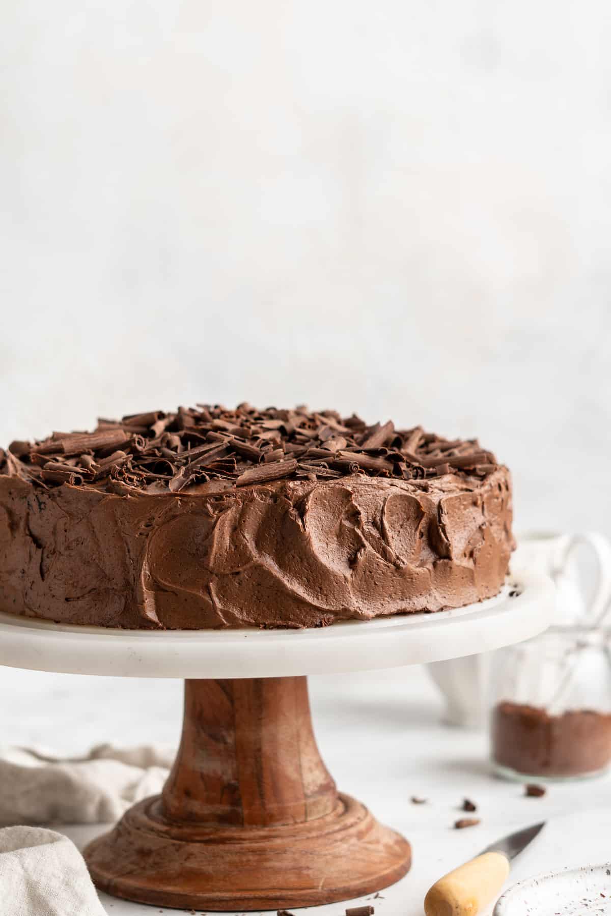 Whole vegan chocolate cake on cake stand