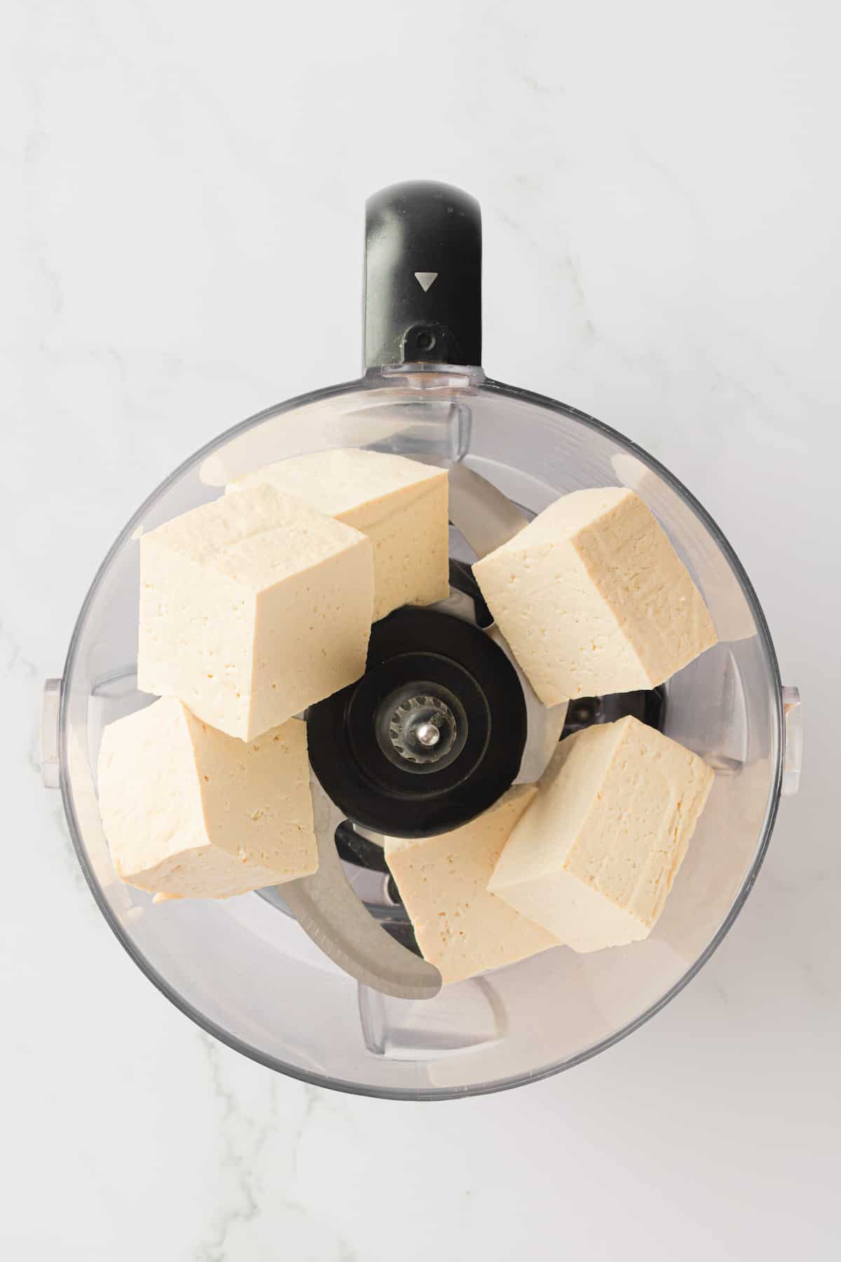 Cubes of tofu in food processor