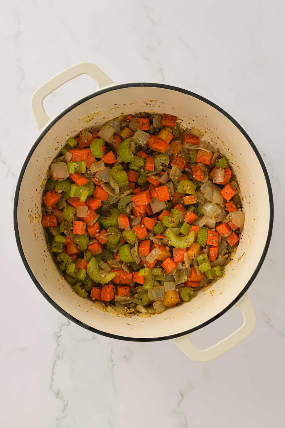 Overhead view of cooked vegetables in Dutch oven