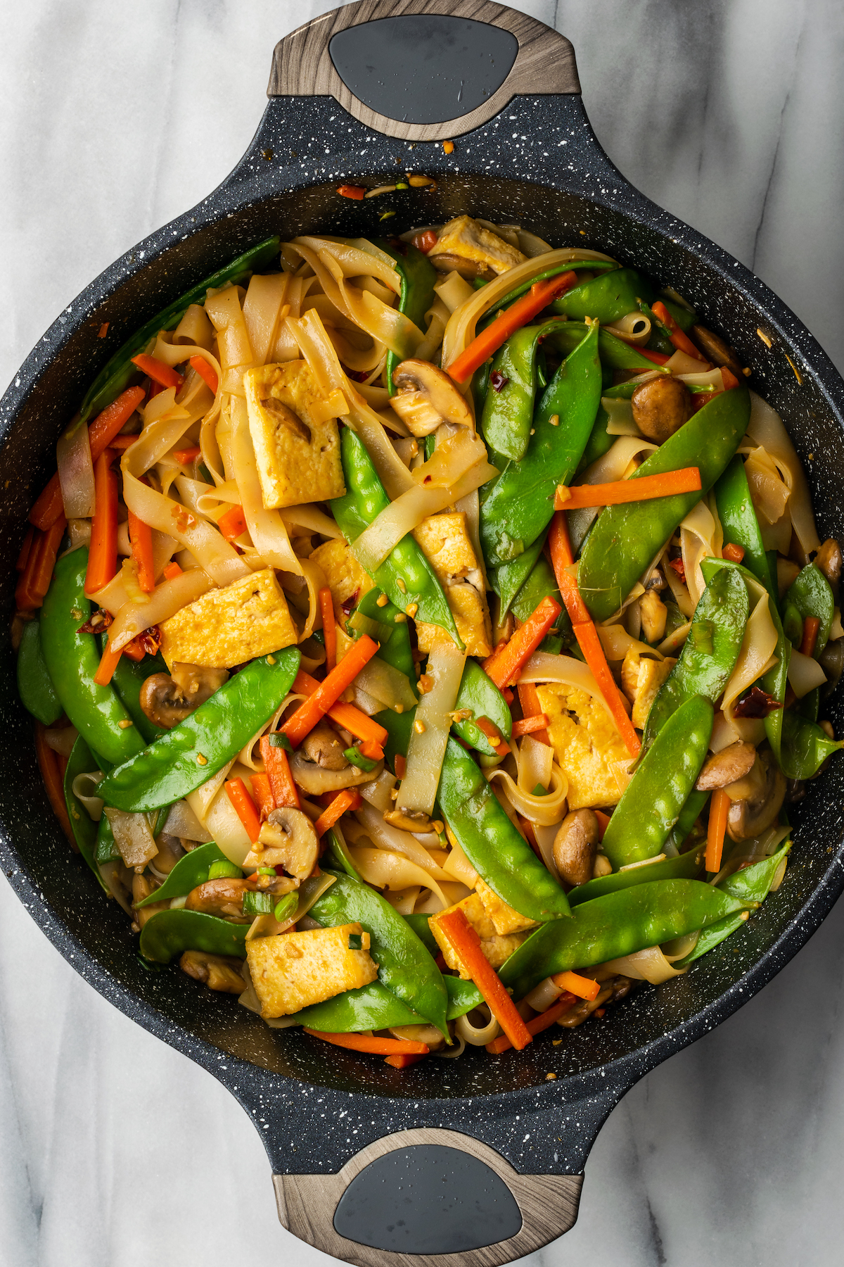 Vegan chow fun noodles in pan