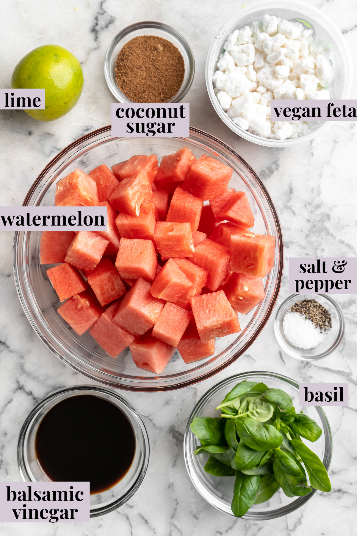 Overhead view of ingredients for vegan watermelon feta salad with labels