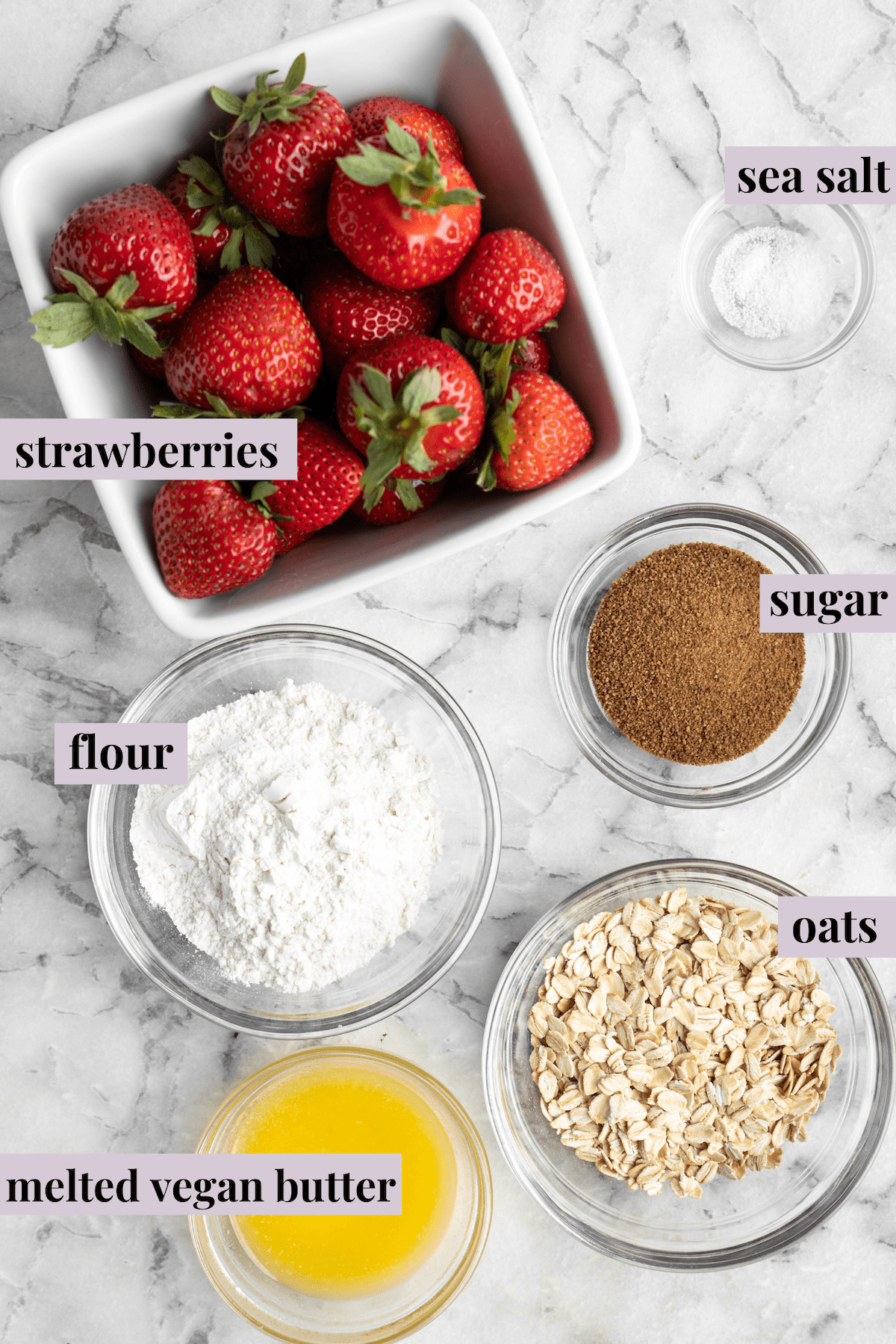 Overhead view of ingredients for strawberry crumble with labels