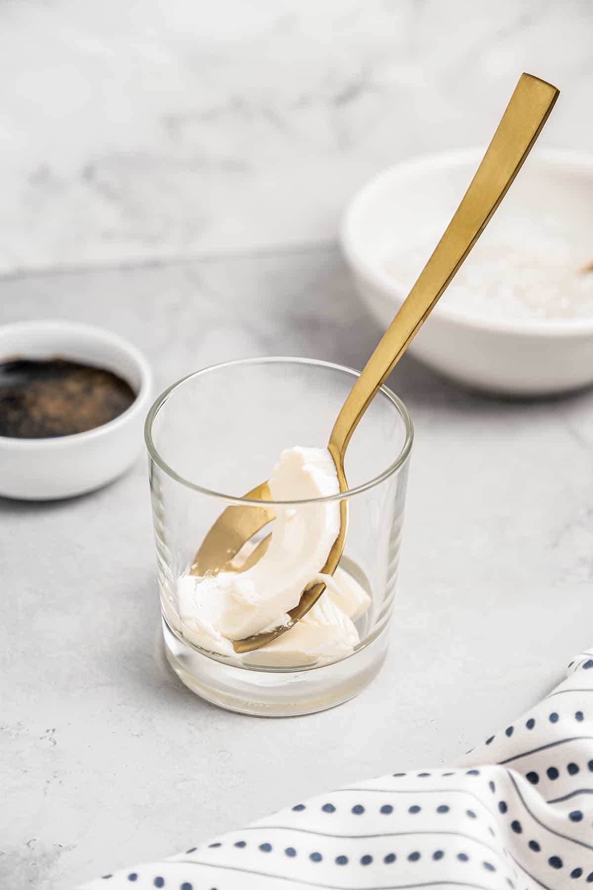 Spoonful of silken tofu in glass