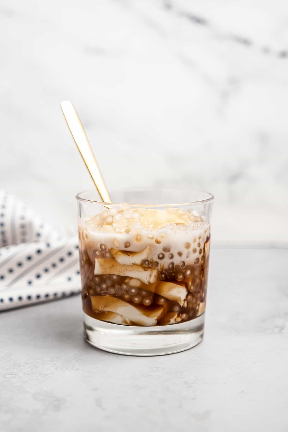 Filipino taho in glass with gold spoon