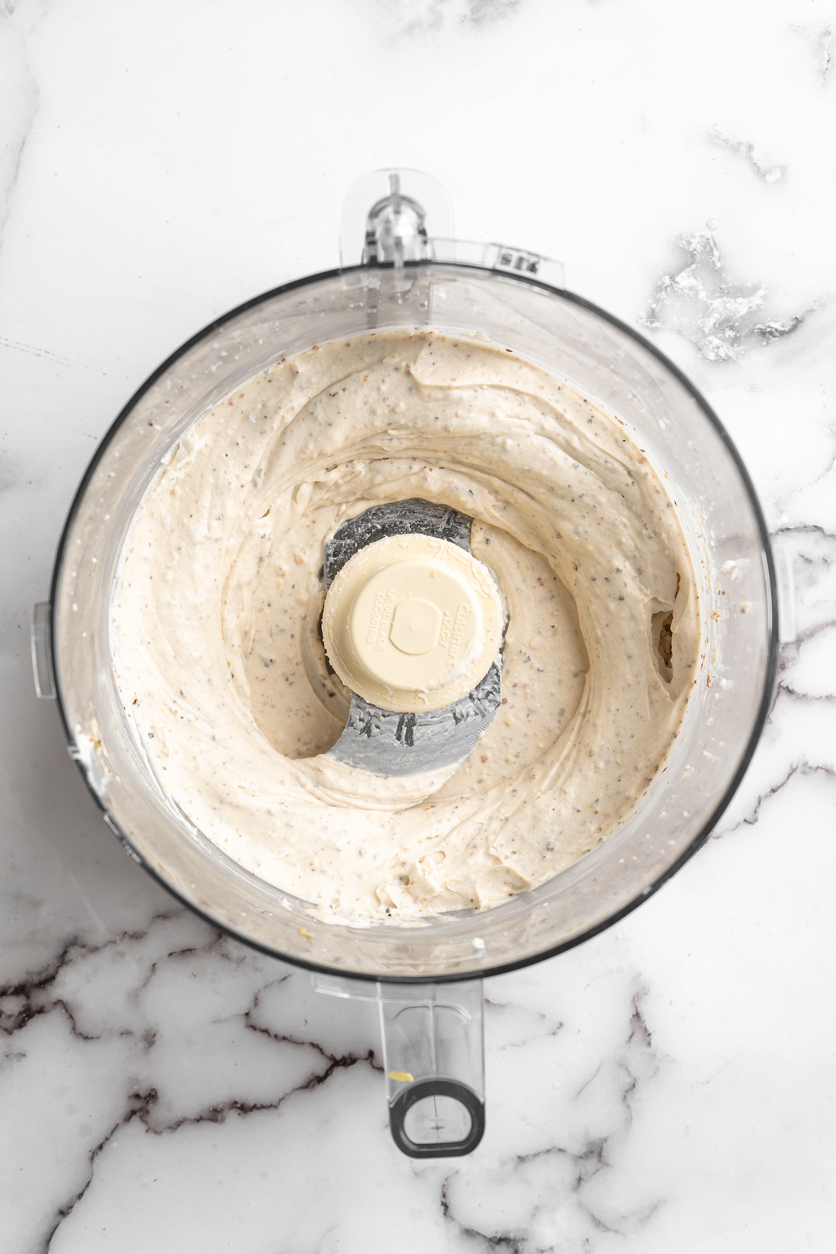 Overhead view of vegan whipped feta in food processor