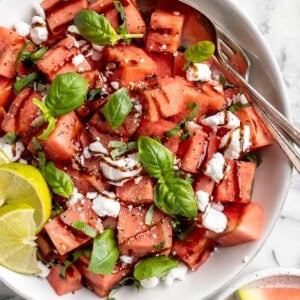 Overhead view of vegan watermelon feta salad in serving bowl