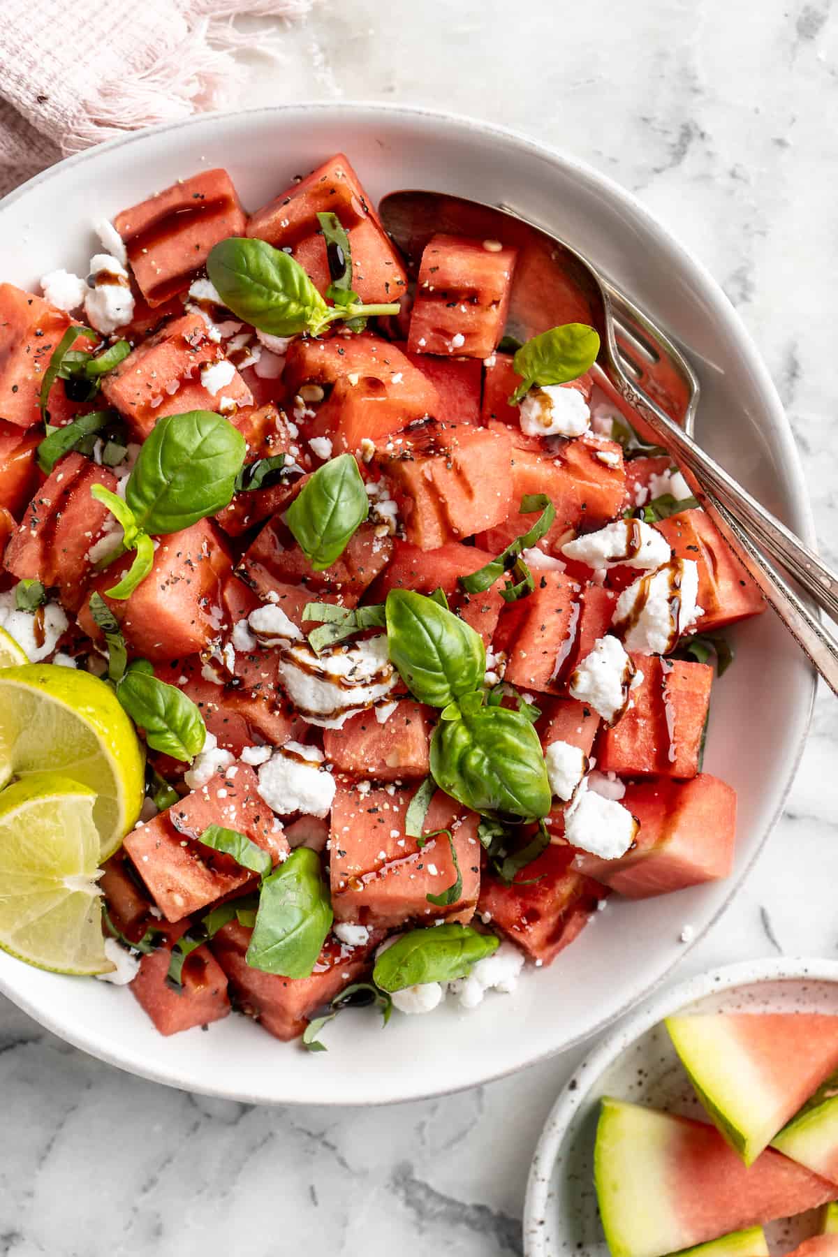 Overhead view of vegan watermelon feta salad in serving bowl