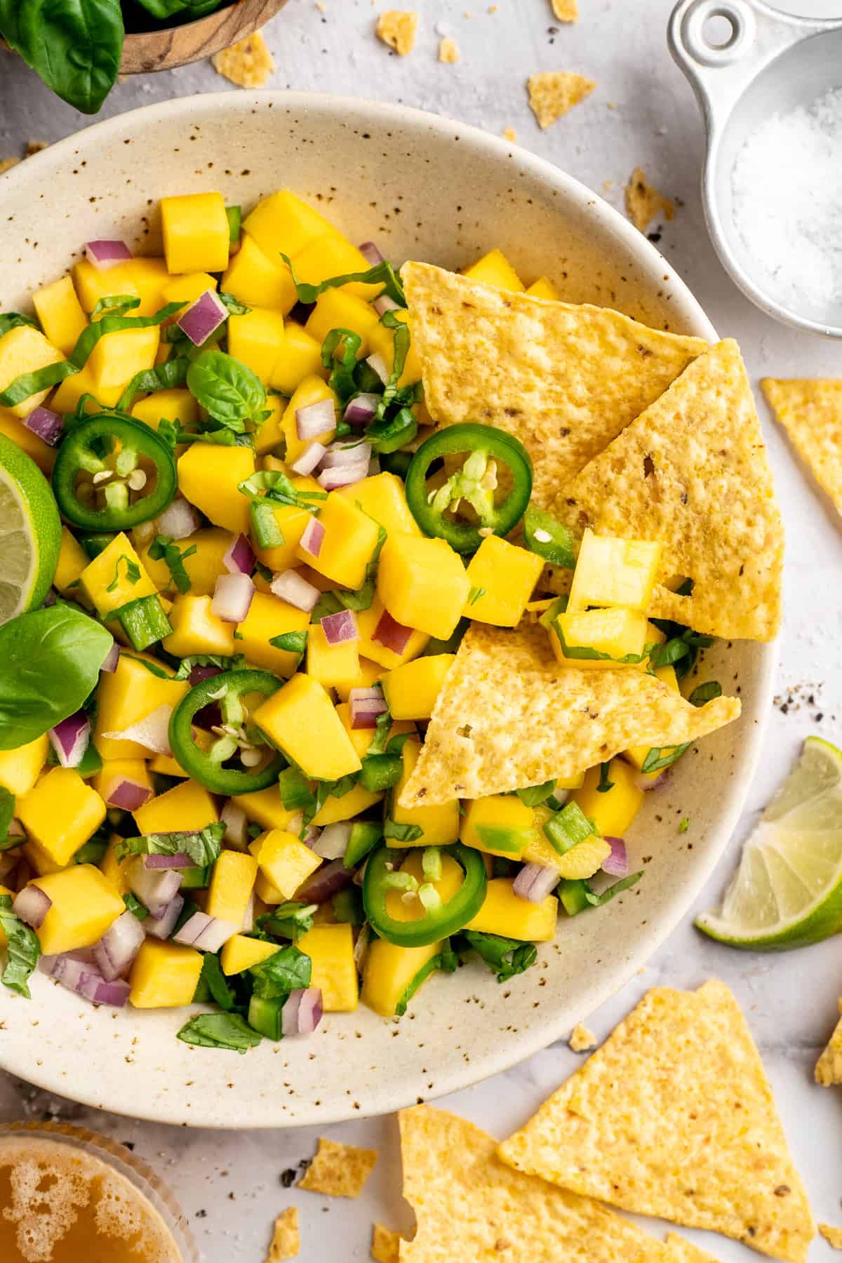 Bowl of mango basil salsa with tortilla chips. - 15