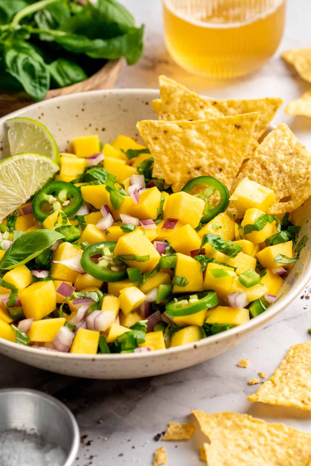 Bowl of mango basil salsa with tortilla chips. - 14