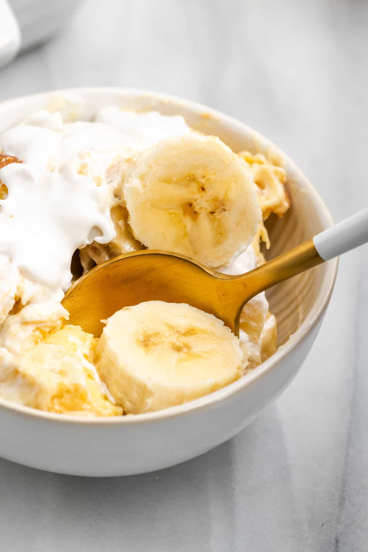 Spoon digging into vegan banana pudding