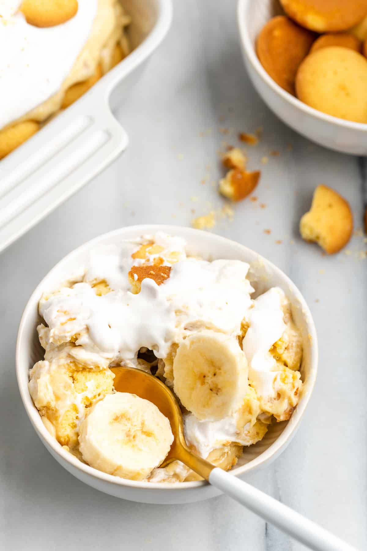 Bowl of vegan banana pudding with spoon digging in