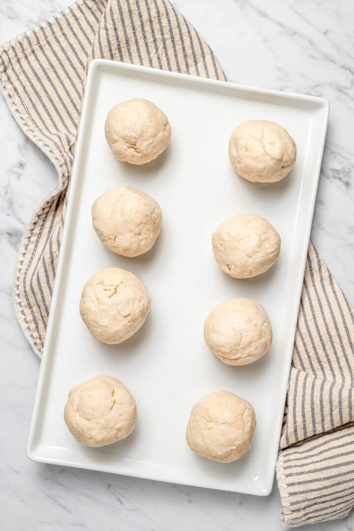 Overhead view of balls of dough for making Jamaican fried dumplings