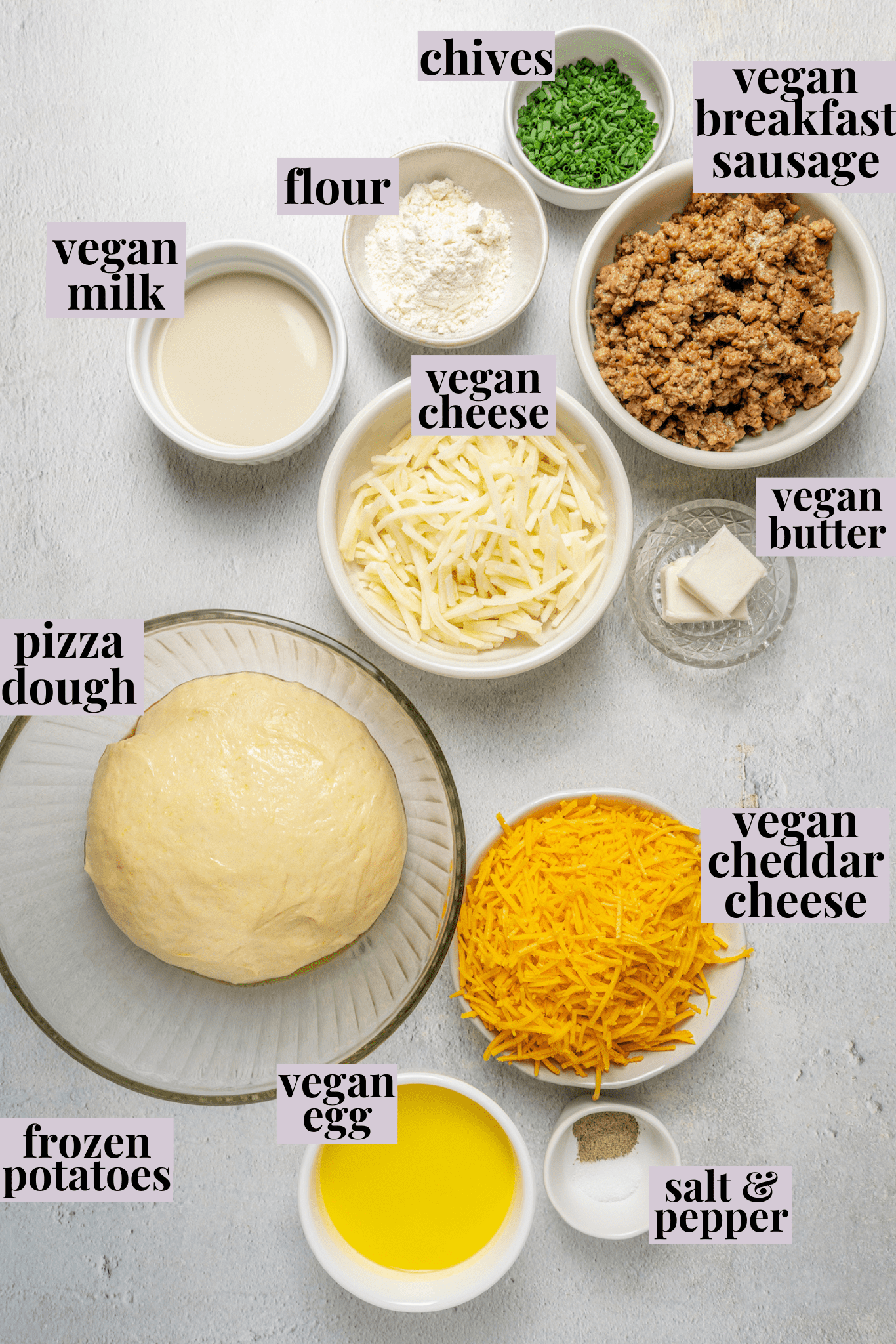 Overhead view of ingredients for vegan breakfast pizza with labels